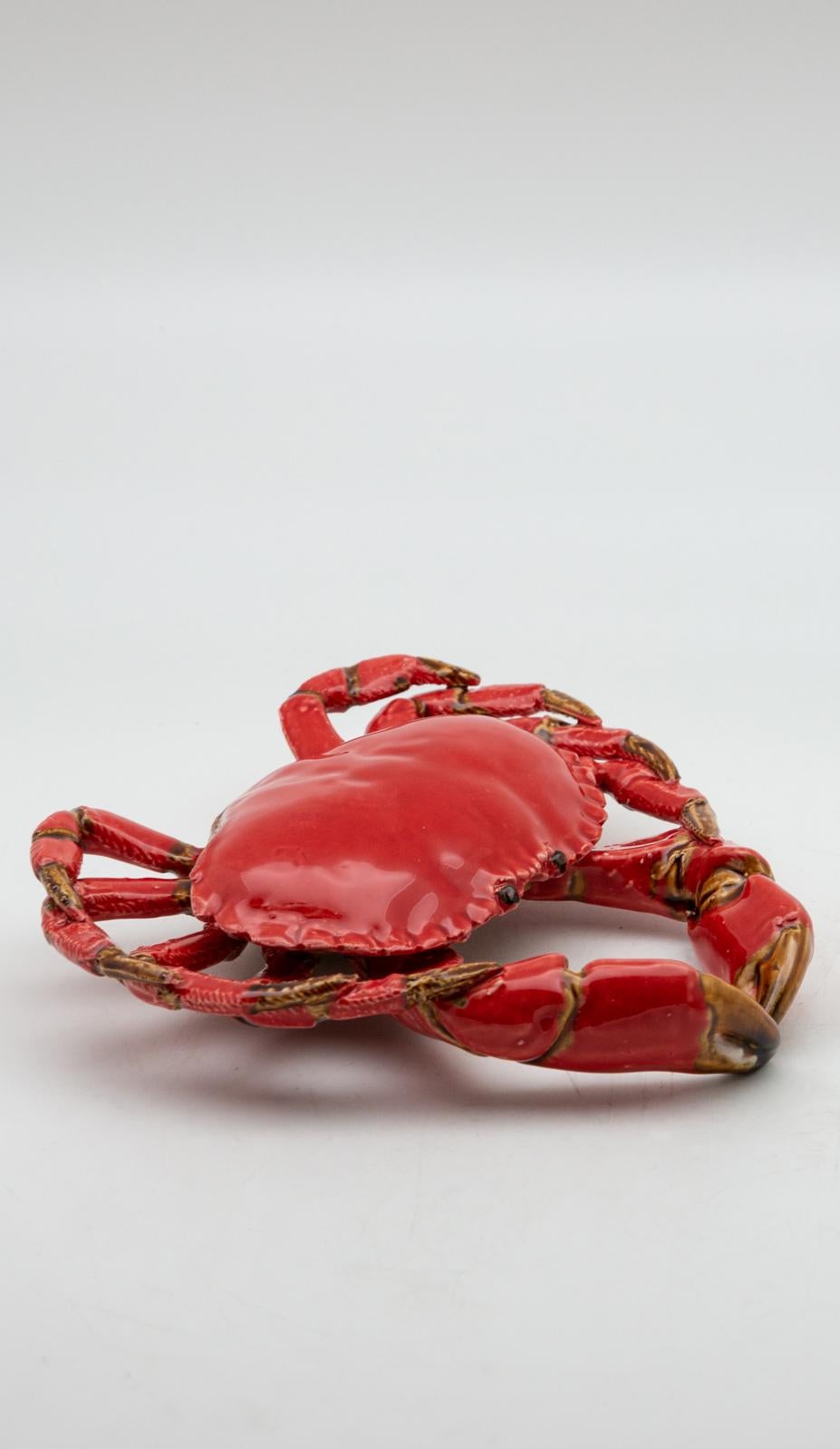 Portuguese Handmade Pallissy or Majollica Red Ceramic Crab. 

Ceramic sea life art has long been a tradition in Portugal.  It was inspired by the 