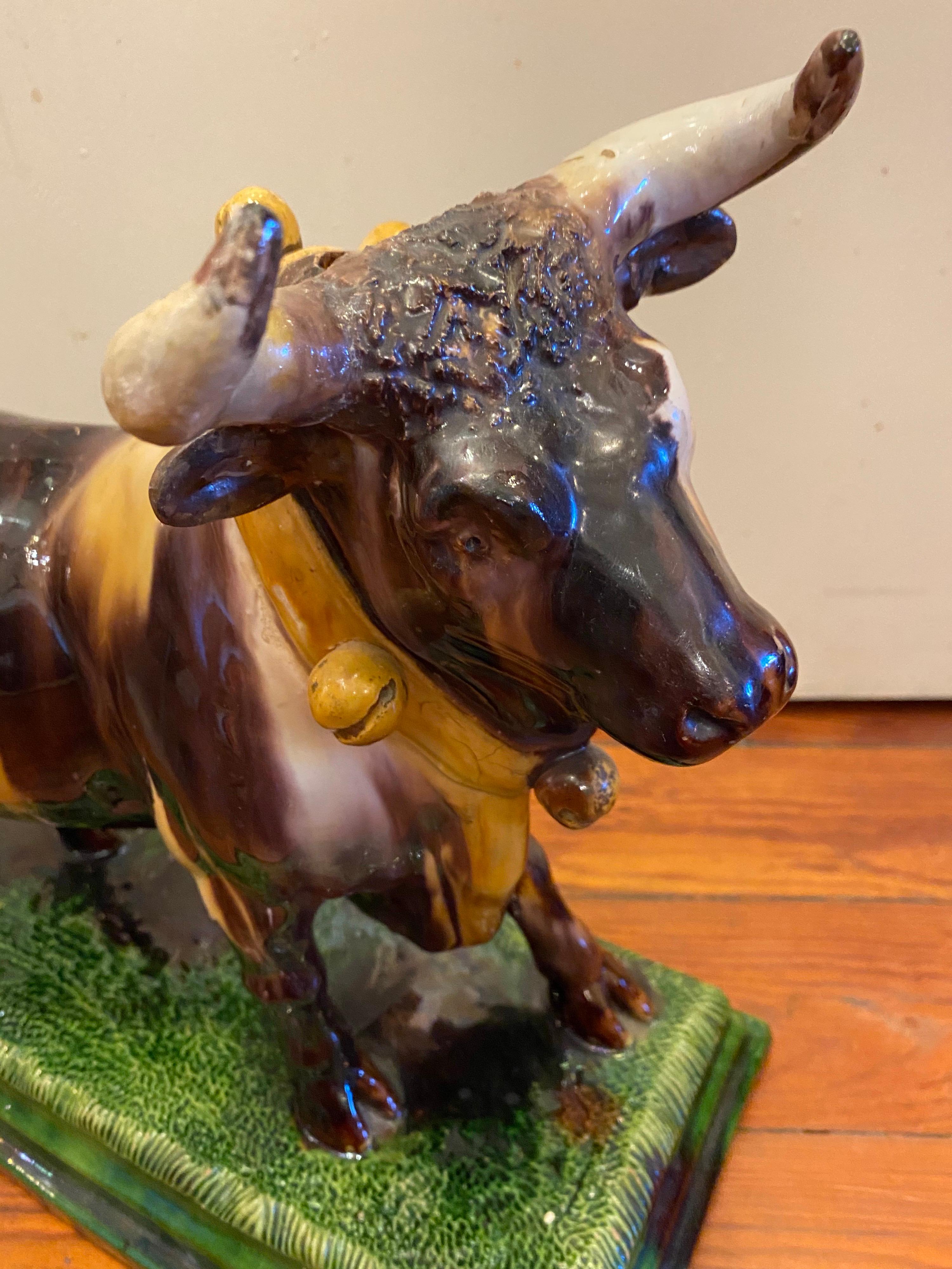Unusual Portuguese Majolica bull form wine jug with a spout behind the horn on head. Signed F. Gomes d'Avellar 1875-1897.