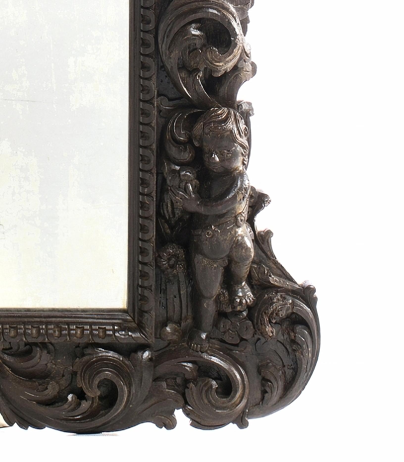 Portuguese Mirror
19th Century, in chestnut wood with carvings finished with 