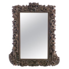 Antique Portuguese Mirror 19th Century, in Chestnut Wood with Carvings with "Puttis"
