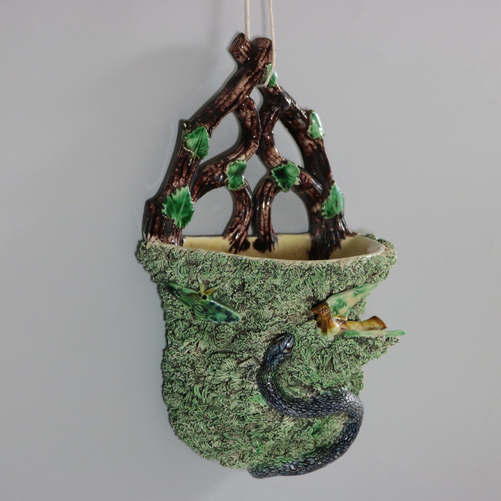 Portuguese Palissy Majolica wall pocket which features a nesting bird, a snake and insects. Colouration: green, brown, grey, are predominant.