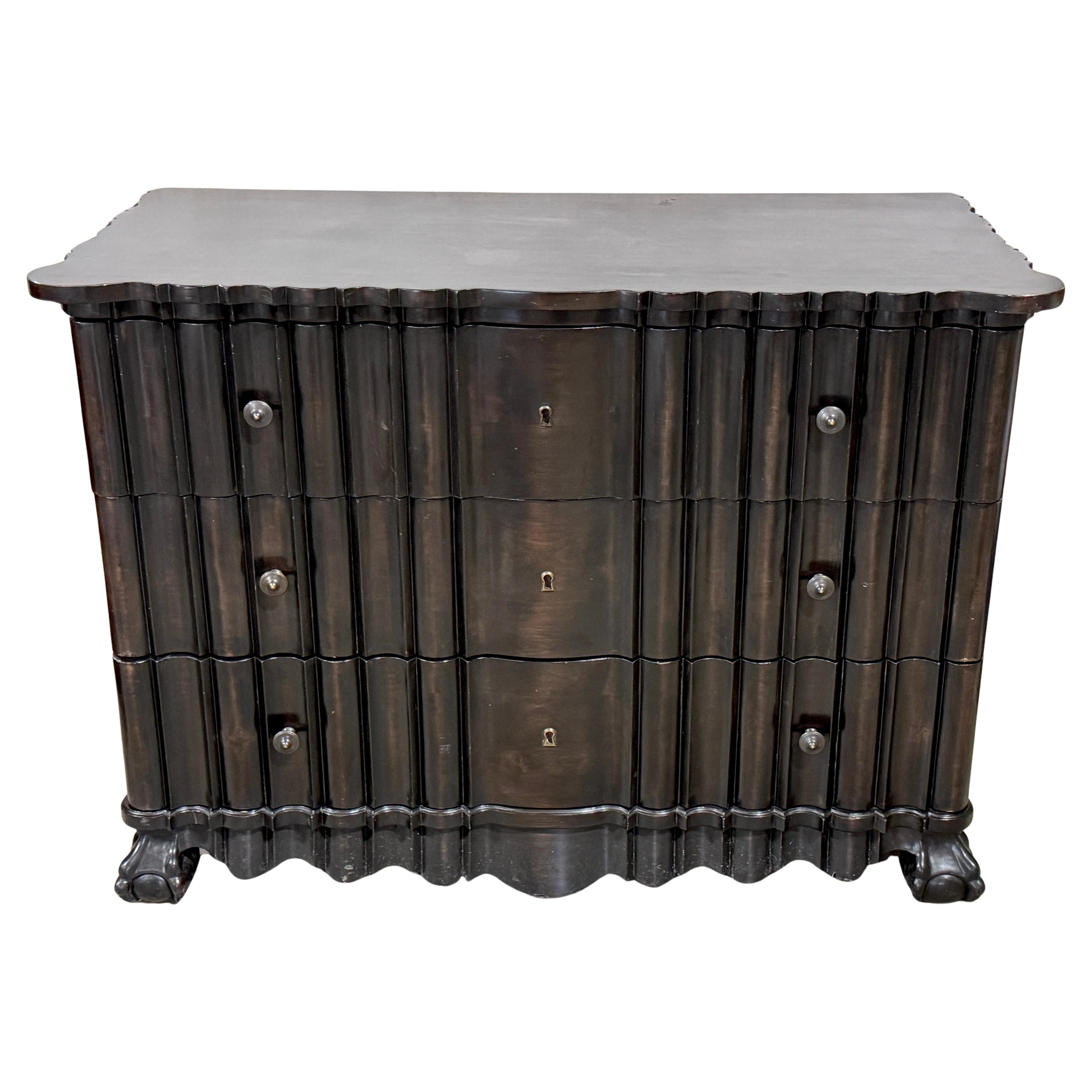 A Portuguese Rococo Ebonized three-drawer chest, 2nd Available 
Cabinet made by Quatrain Furniture Company 
Each of one generous proportions in the Portuguese Rococo style fitted with three-drawers, cabinet-made by the notable Quatrain furniture