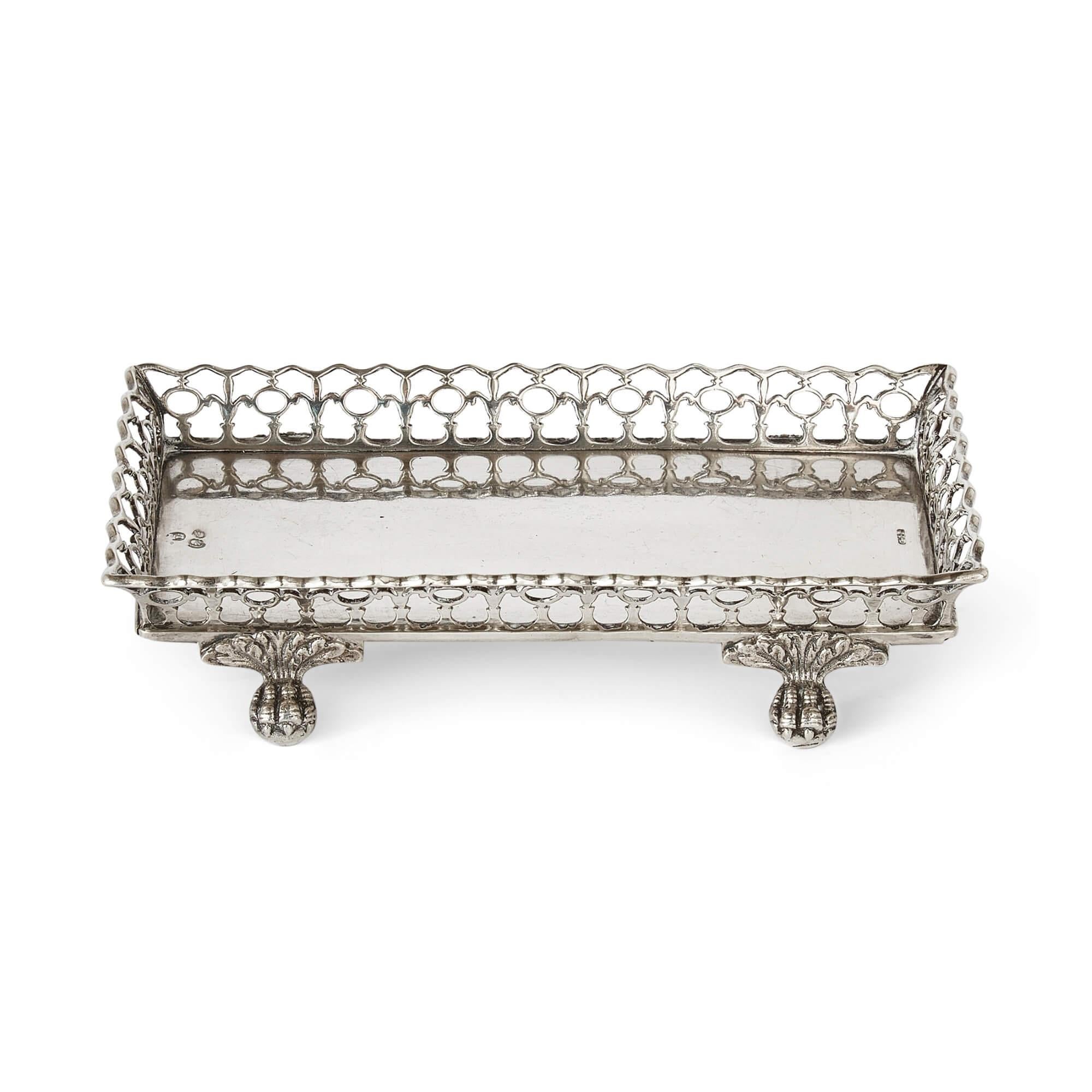 Portuguese silver set of four identical snuffer trays 
Portuguese, 19th Century
Height 3cm, width 16cm, depth 10cm 

A quartet of splendidly crafted Portuguese silver snuffer trays, hailing from 19th Century, constitutes this set. With their