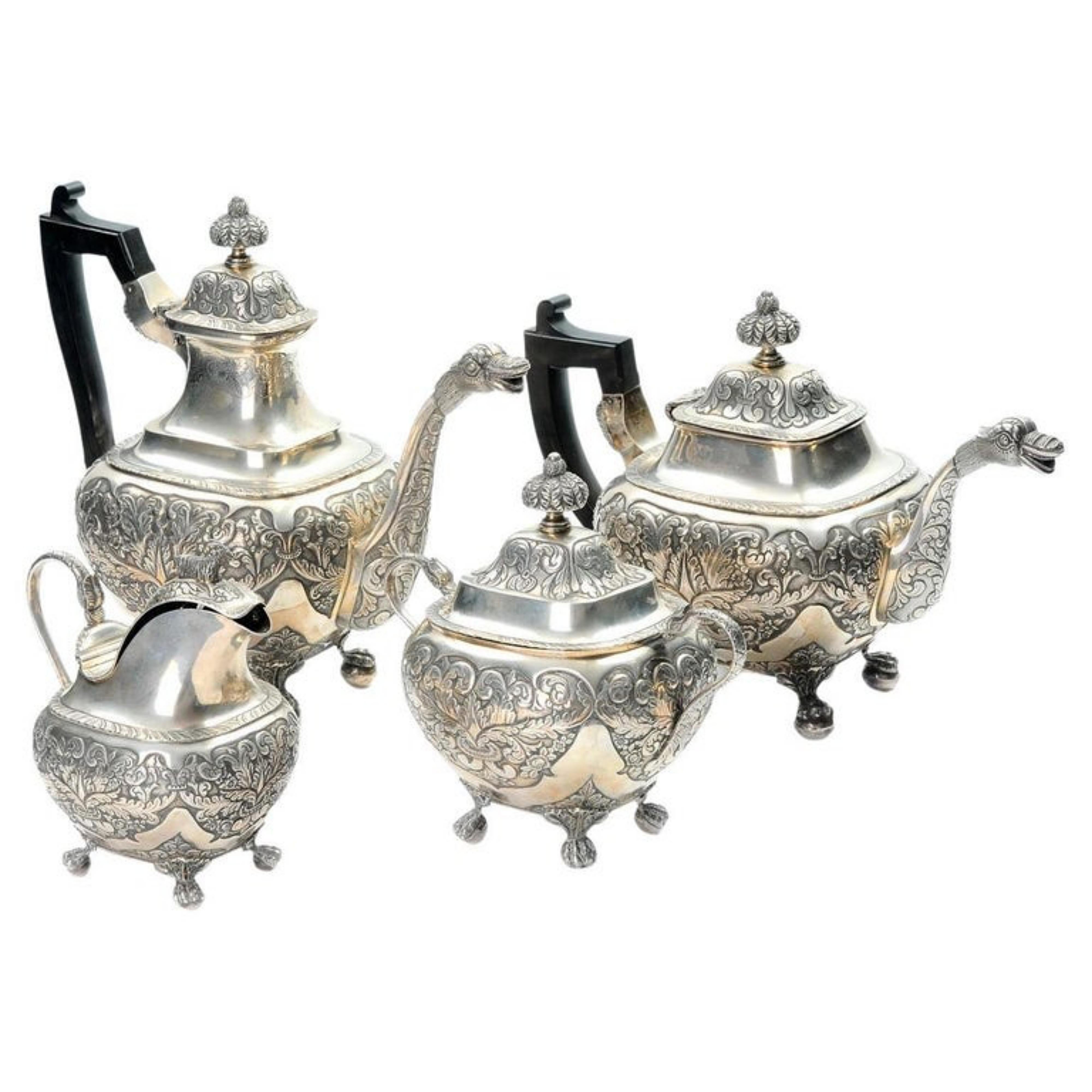 Portuguese silver tea and coffee service
19th Century
composed of, teapot, coffee maker, milk jug and sugar bowl. Body profusely decorated with floral motifs. Handles in rosewood. Lisbon assay mark (L-41) in use from 1843 to 1870. Unidentified
