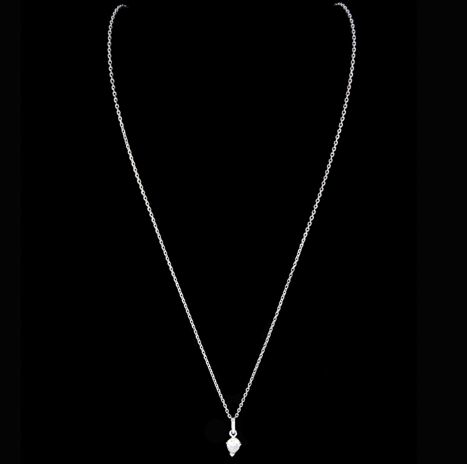A timeless and refined necklace crafted in 800/1000 white gold, featuring a luminous pear-shaped diamond weighing approximately 0.70 carats. This piece, signed by the Portuguese maker Veado (active 1985–2020), exemplifies understated luxury with its