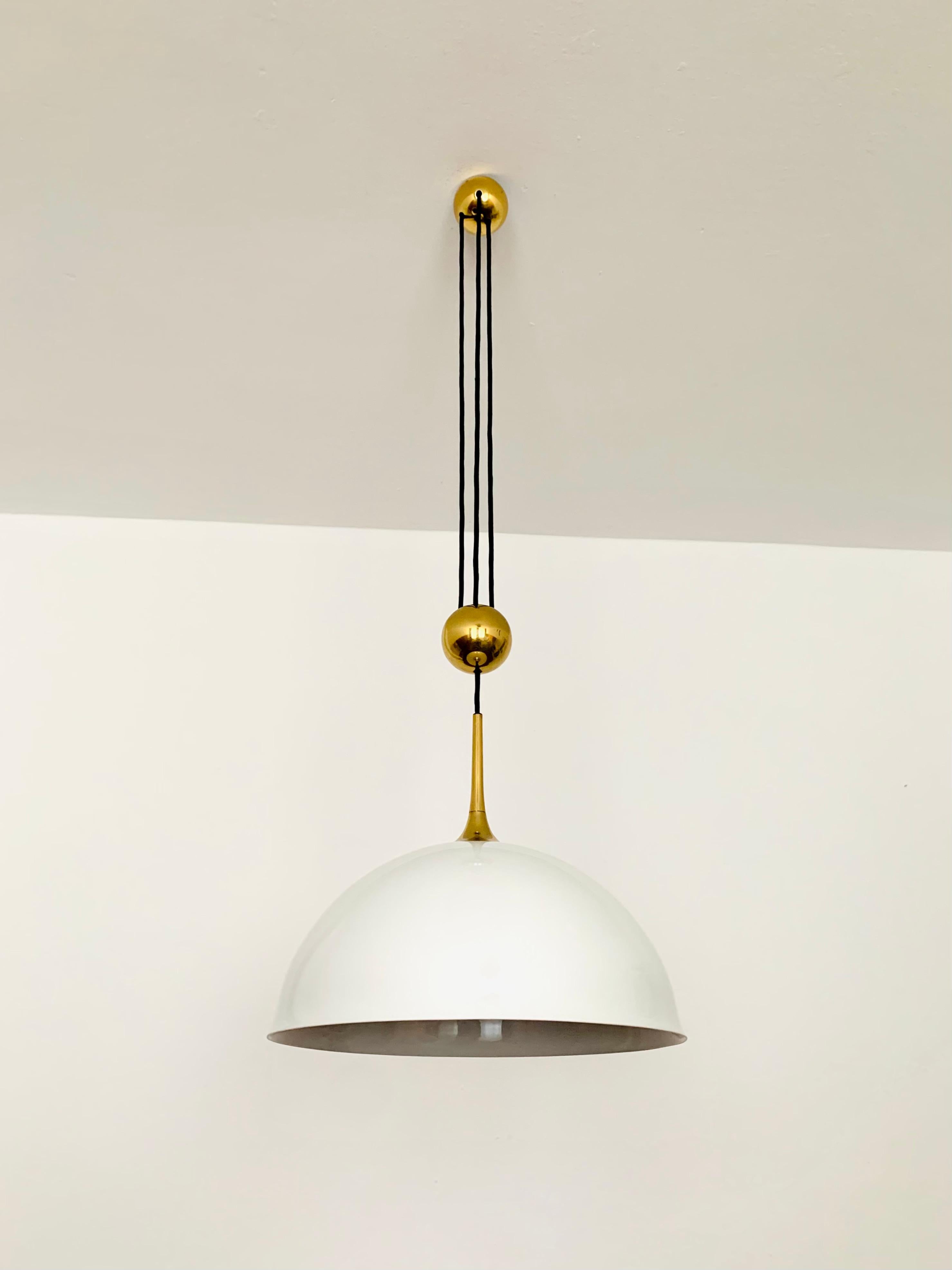 Very nice, height-adjustable pendant lamp from the 1970s.
The lighting effect of the lamp is extremely beautiful.
The design and the very beautiful details create a very noble and pleasant light.
The lamp creates a very cozy atmosphere and is of