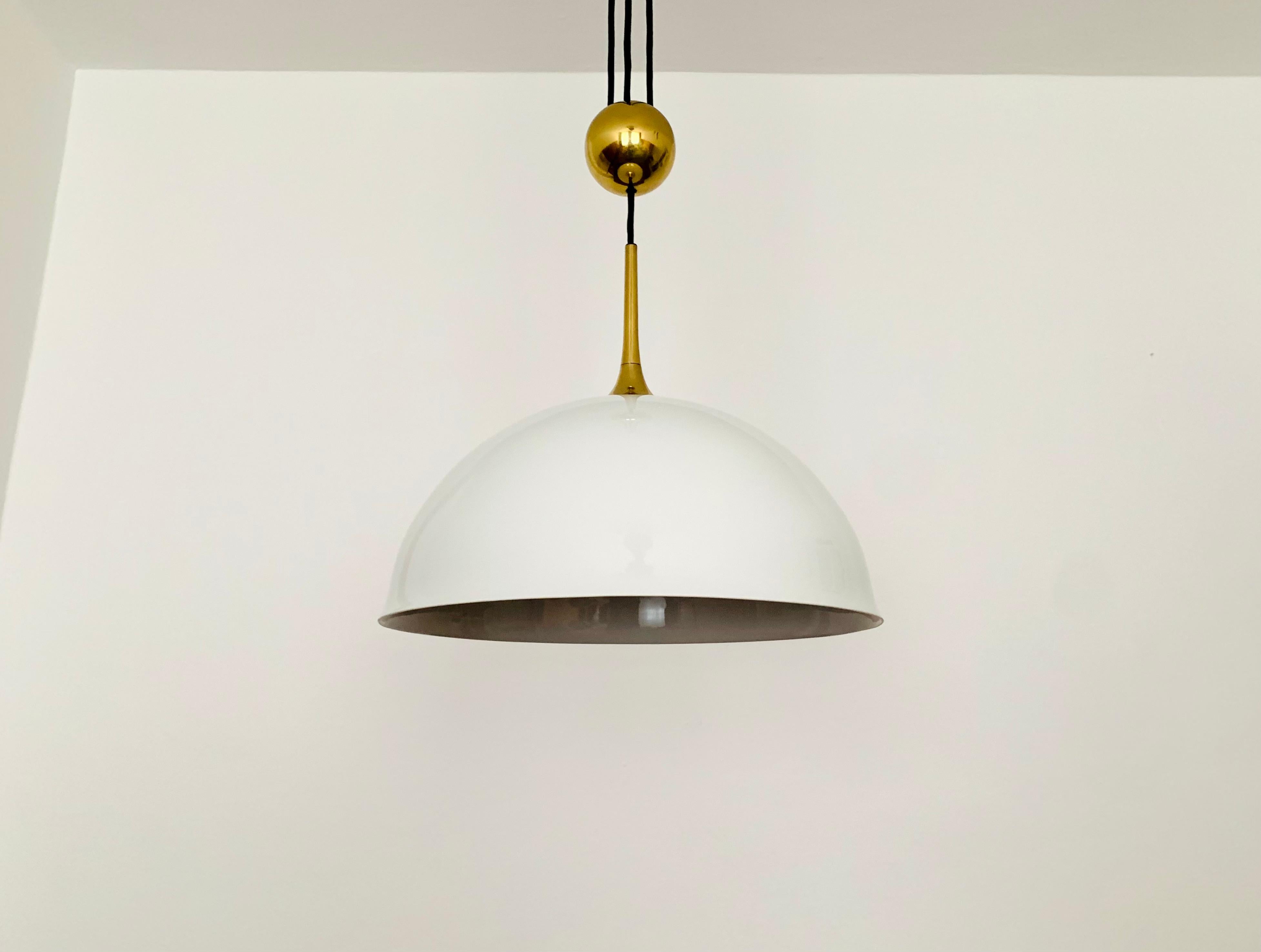 Very nice height-adjustable pendant lamp from the 1970s.
The lighting effect of the lamp is extremely beautiful.
The design and the very beautiful details create a very elegant and pleasant light.
The lamp creates a very cozy atmosphere and is very