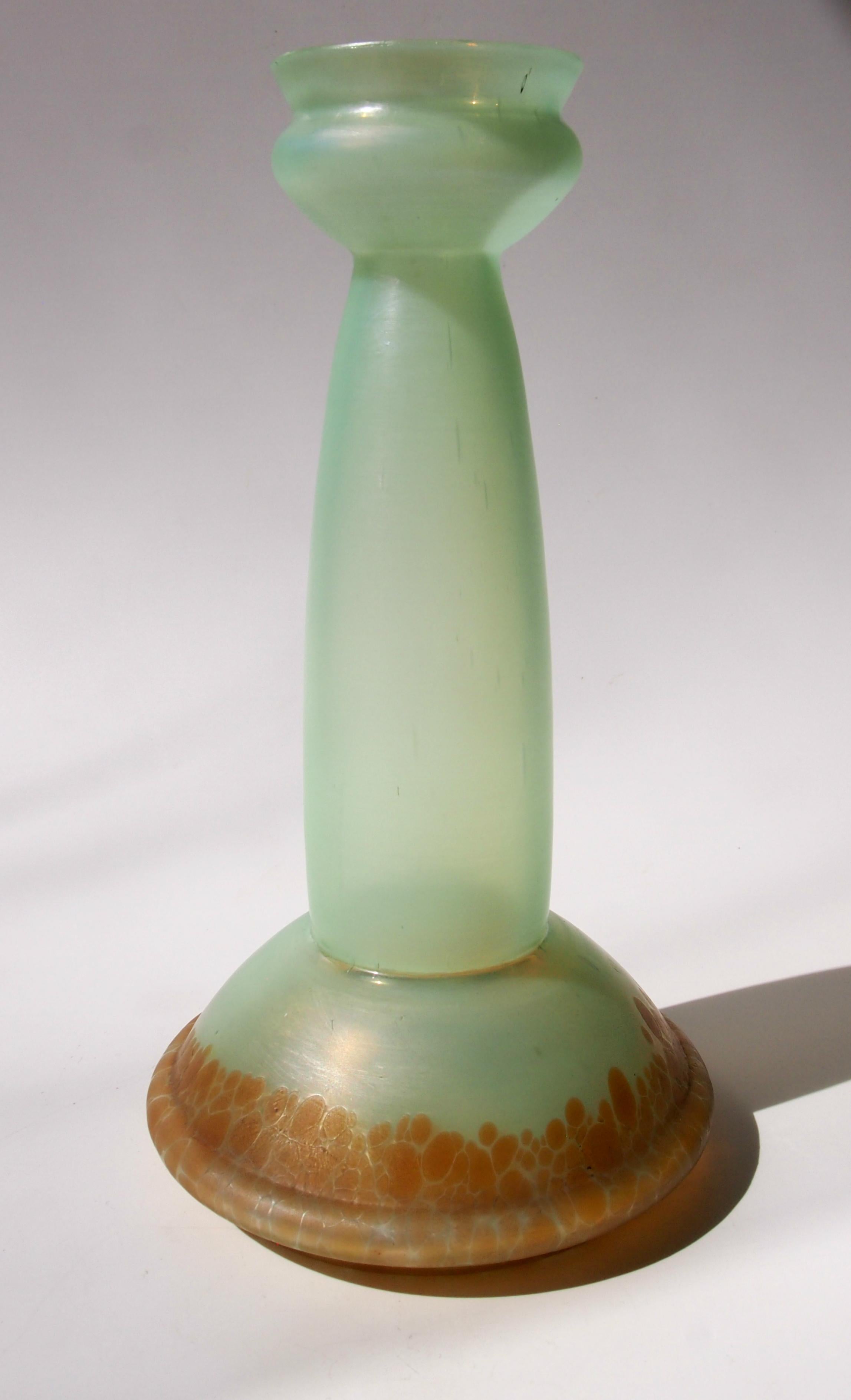 Striking angular Poschinger mottled orange/brown over pale greeny/yellow iridised vase.

Ferdinand Von Poschinger was one of Germany's most successful Glass houses, specializing in iridised glass -their best pieces, like this one, often out did