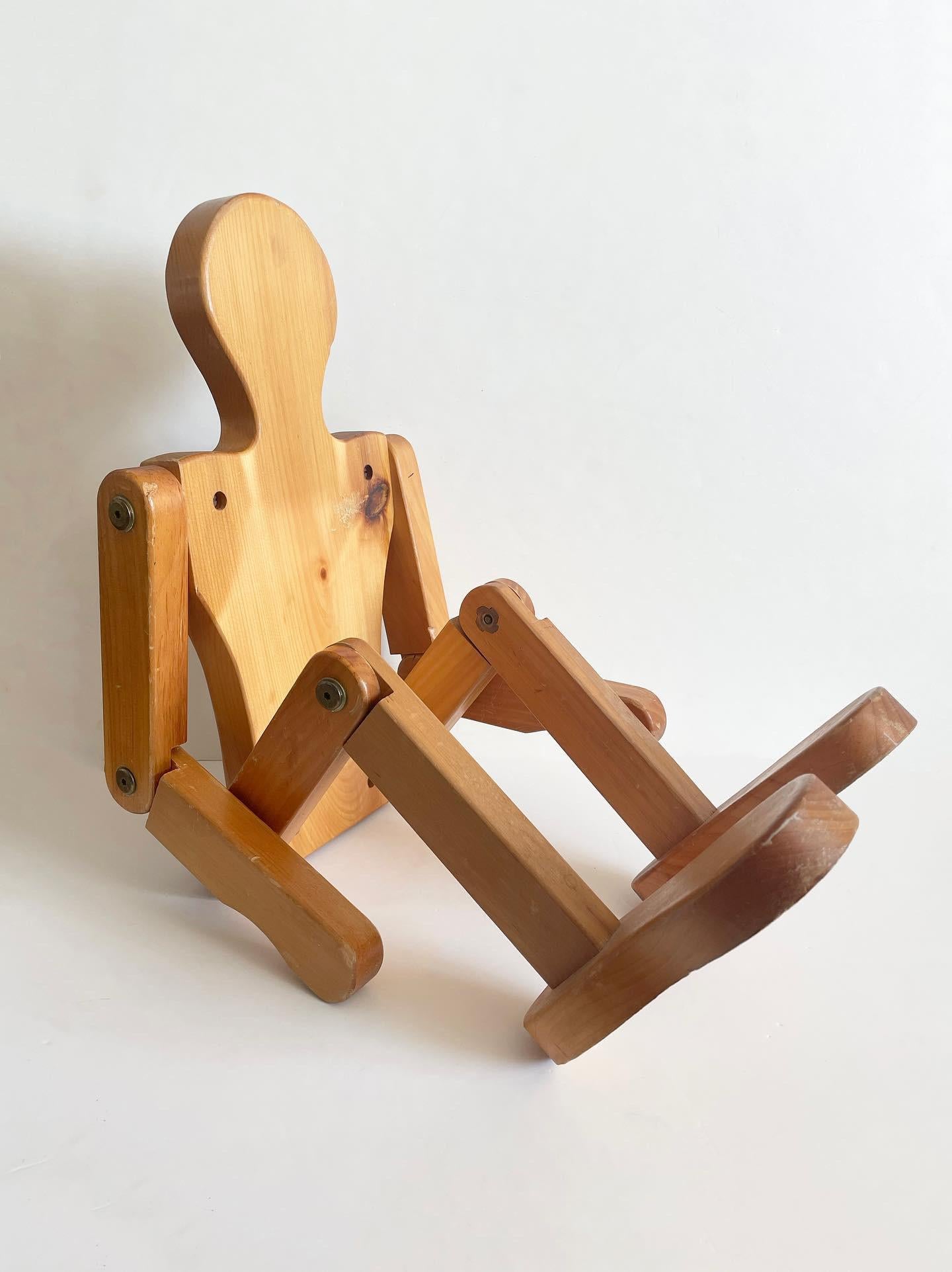 Articulated posable mannequin made for the 1992 Barcelona Olympics. Perfect pedestal/ small side table size measuring 30” tall when not bent.