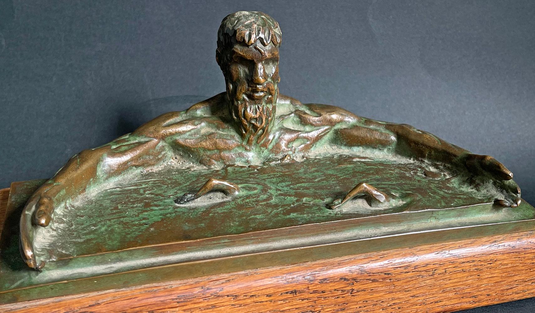 Enormously important, both artistically and historically, this unique bronze depicting a monumental Poseidon figure calming the sea and making space for swimmers to complete below, was sculpted by Joe Brown at the behest of the Amateur Athletic