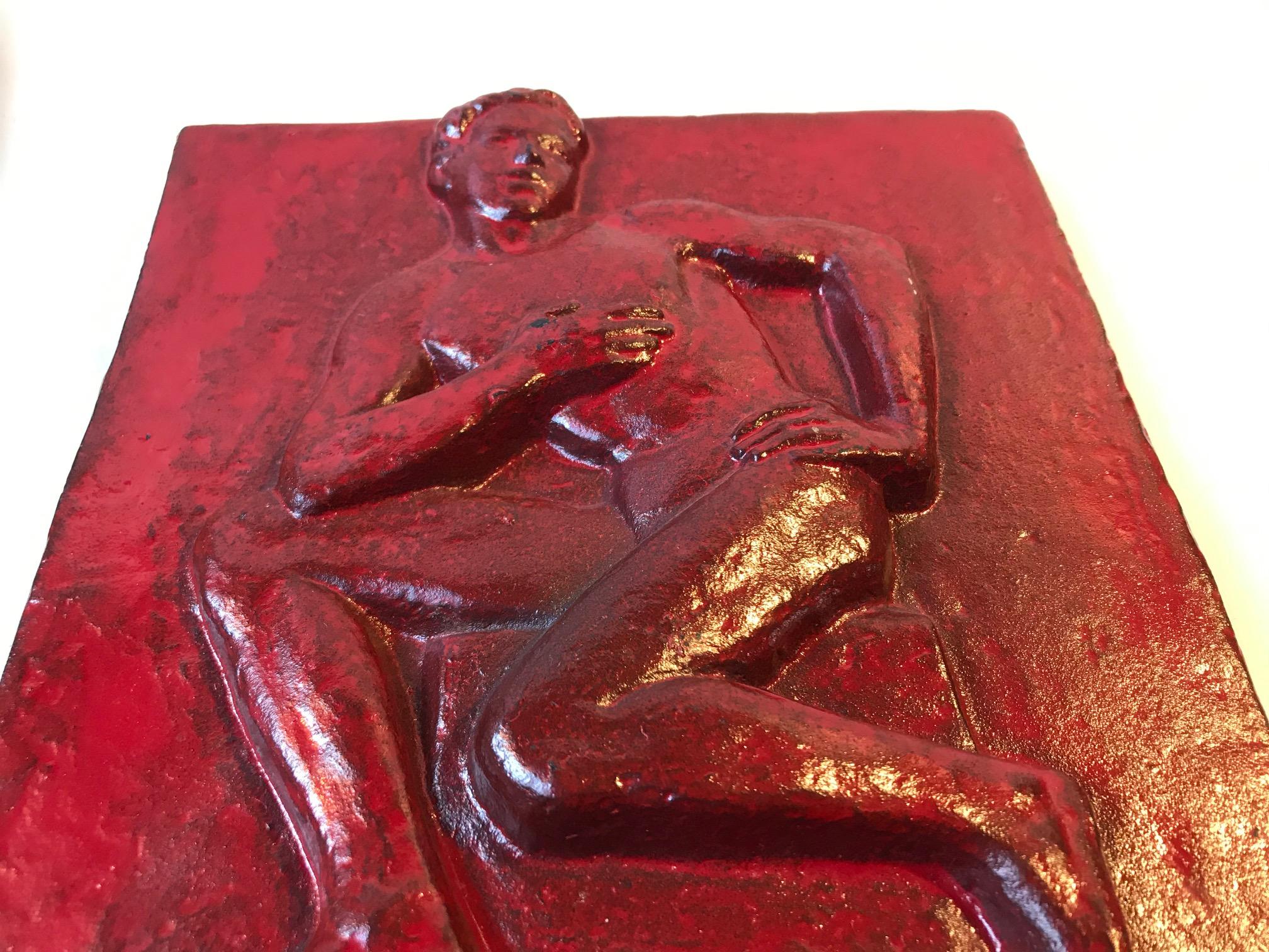 Modern interpretation of Classical Greek sculpting. This piece executed in red enameled cast iron was made by the danish artist and sculptor Jørgen Gudmundsen-Holmgreen and serialized through H. Rasmussen & Co Iron Foundry in Odense, Denmark. This