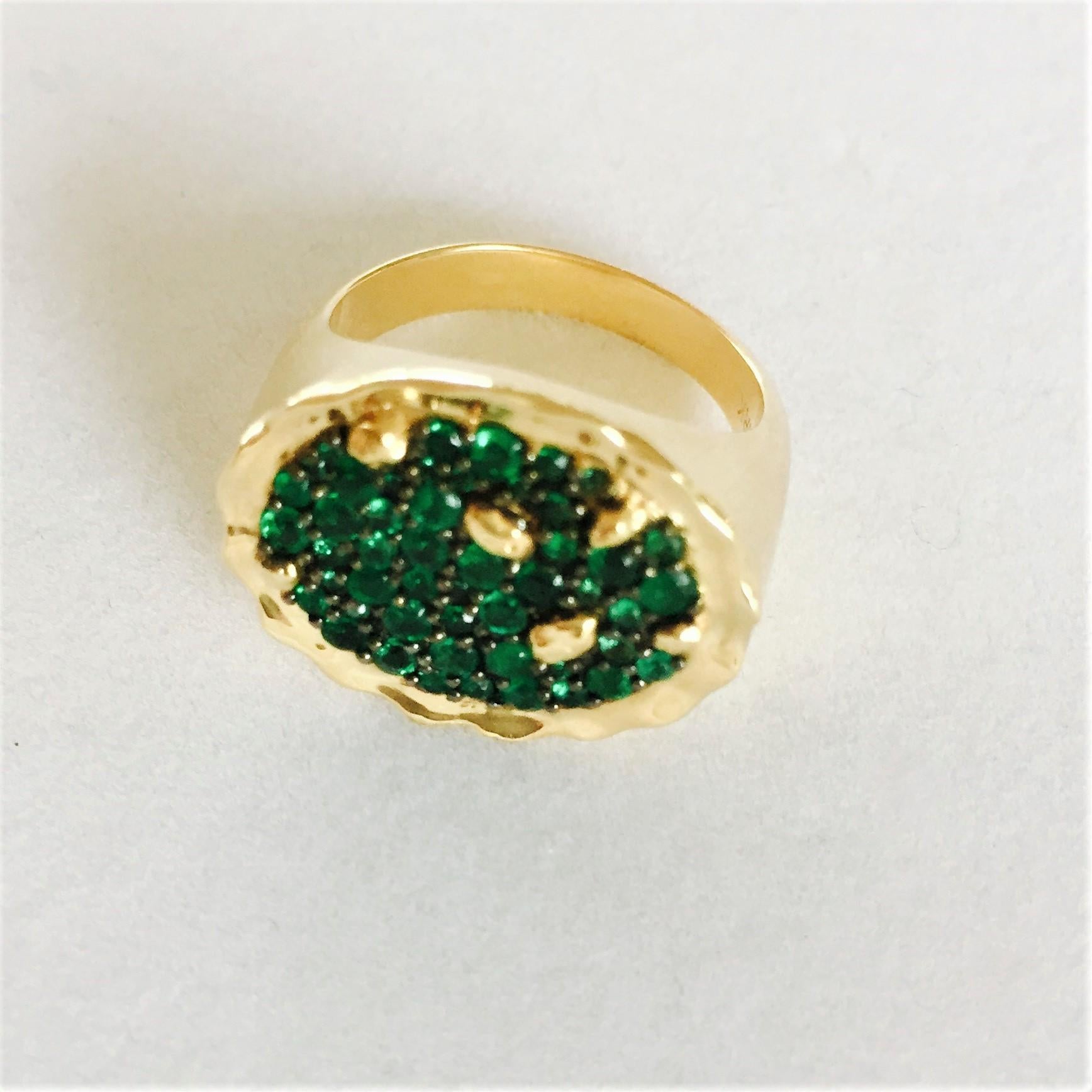 The STENMARK Positano ring in 18 karat yellow gold and emerald was inspired by the dramatic landscape of the Amalfi coast of southern Italy, the gold representing the sandy and rocky coastline edging the blue green water, with gold ‘rocks’ emerging