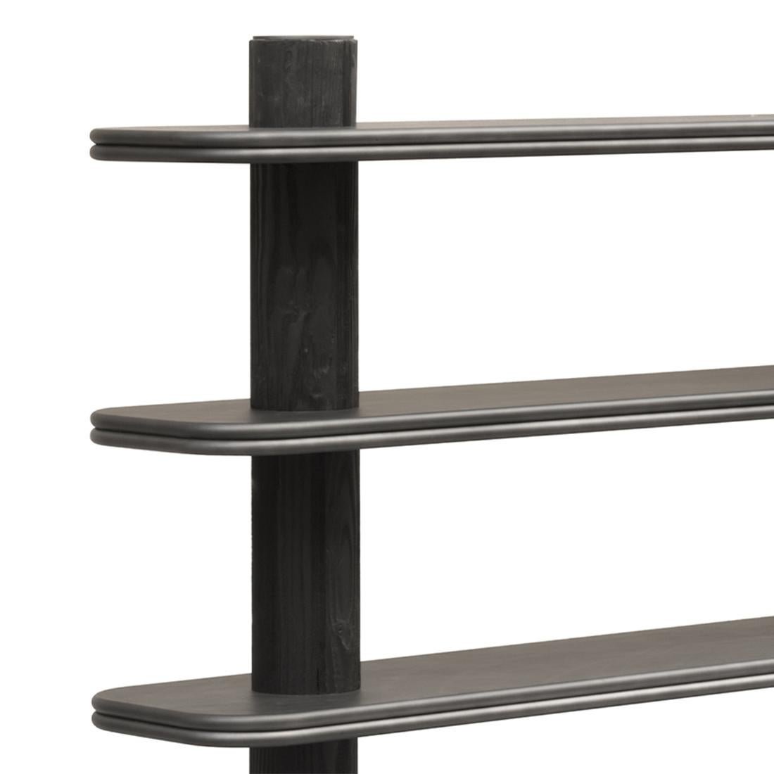 Bookcase Positano black with 2 poles structure 
in solid wood in dark lacquered finish and solid
wooden shelves and base covered with dark 
bronzed genuine leather.
Also available with other leather colors on request.