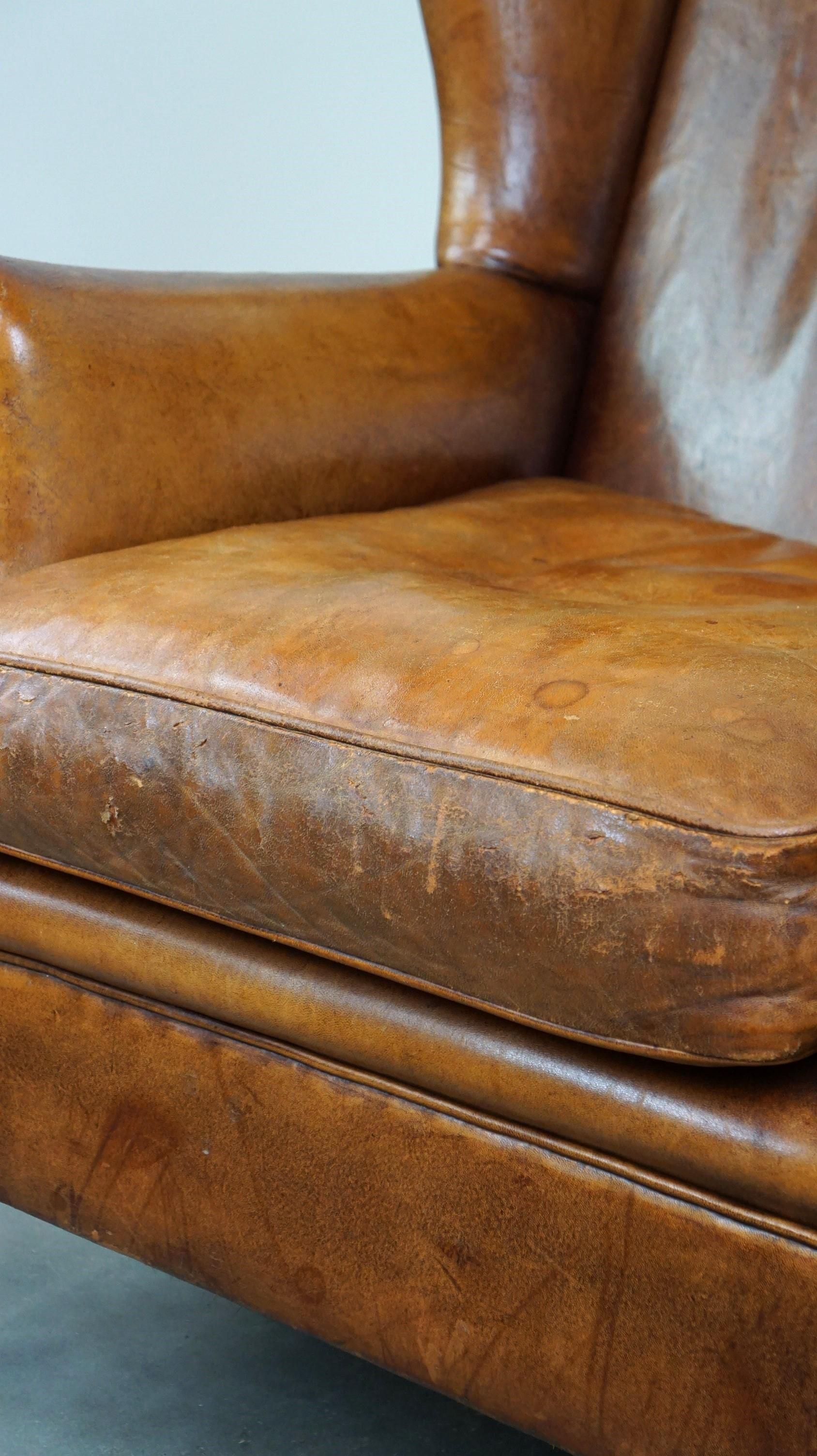 Positively lived-in sheepskin leather wing chair with pleasant seating comfort 4