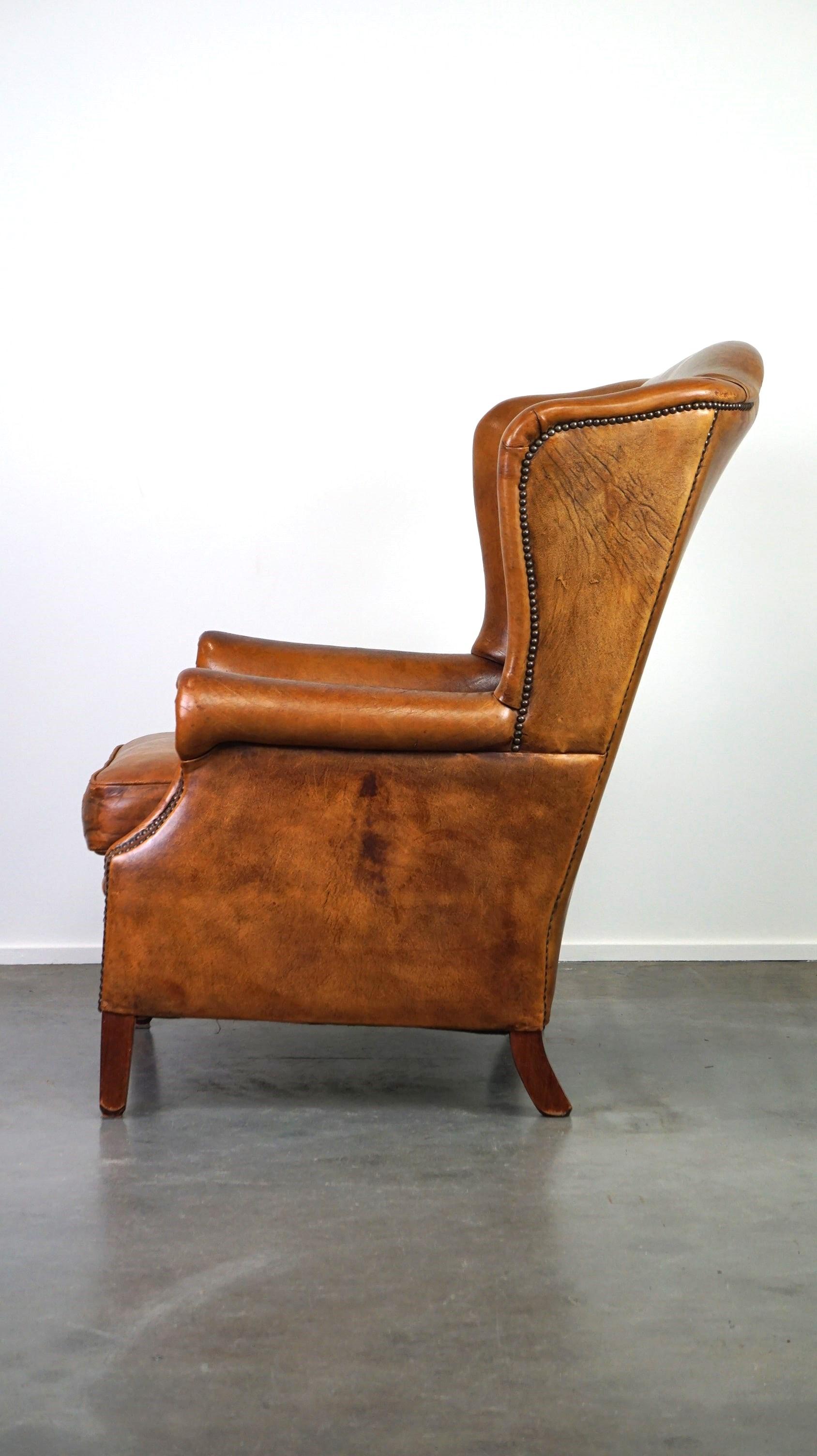 Positively lived-in sheepskin leather wing chair with pleasant seating comfort In Good Condition In Harderwijk, NL