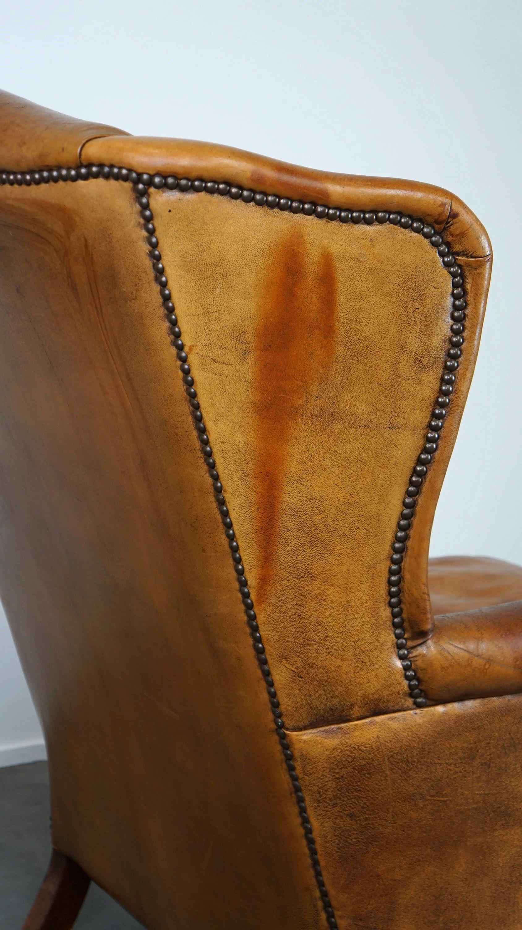 Positively lived-in sheepskin leather wing chair with pleasant seating comfort 2