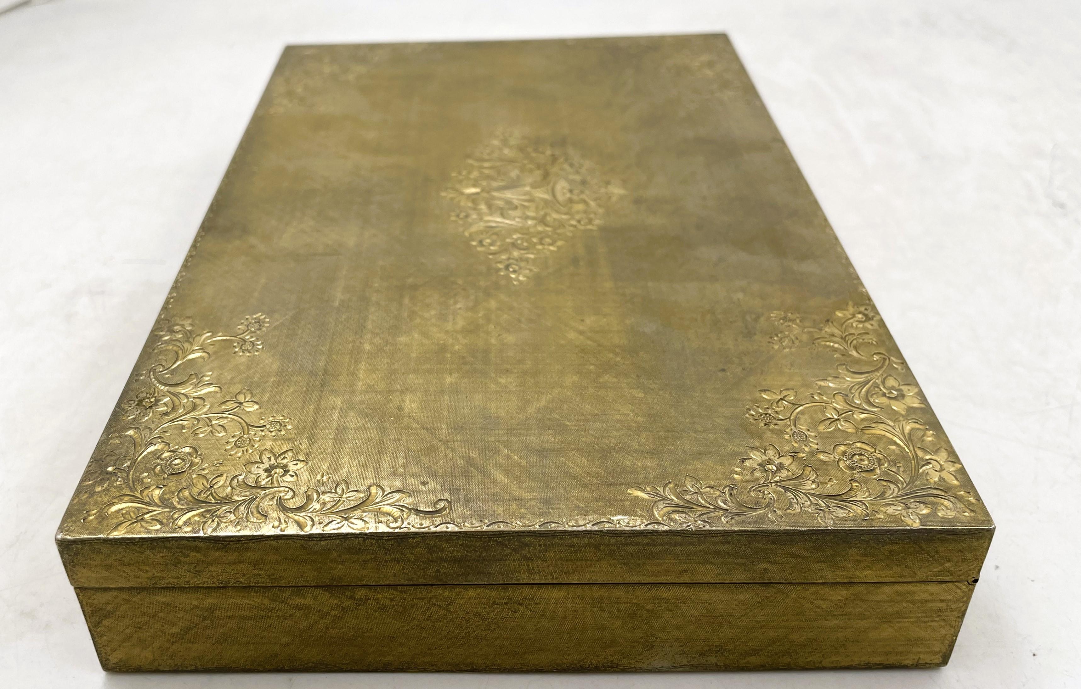 Possibly Buccellati, Italian gilt silver tablebox adorned with engraved floral and geometric motifs, from the 20th century. It measures 8 3/4'' by 6'' by 1 1/2'', weighs 19.8 troy ounces, and bears hallmarks as shown. 

Please feel free to ask us