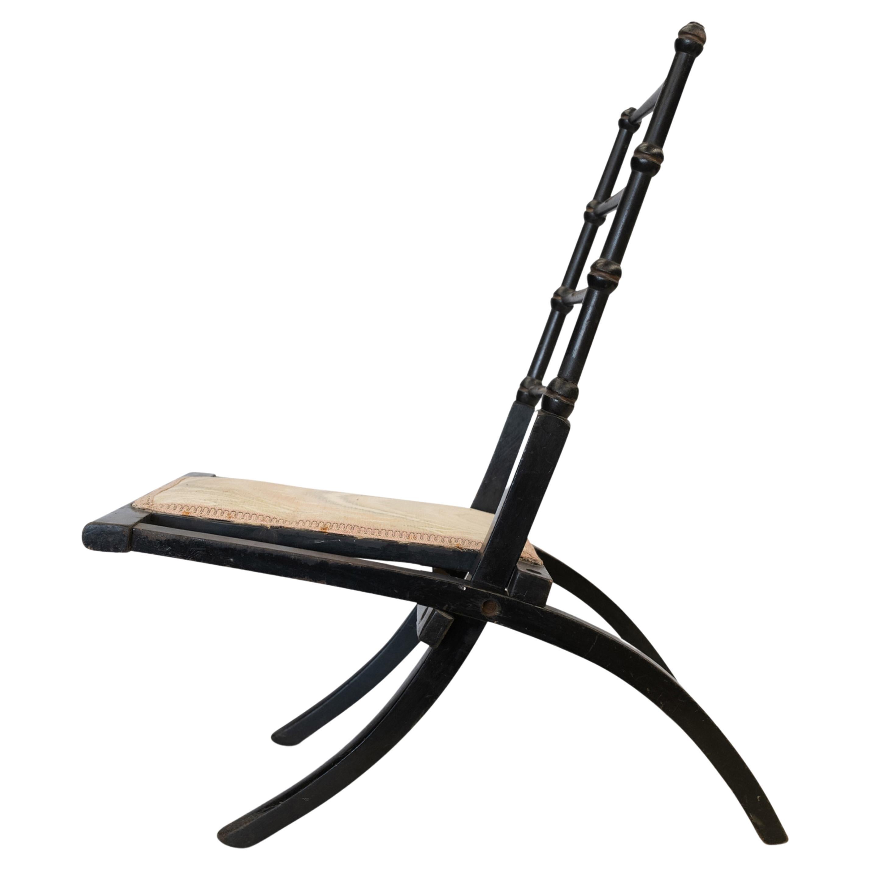 Possibly by E W Godwin, Japanned Ebonized Cane Folding Chair, Gilt Highlights