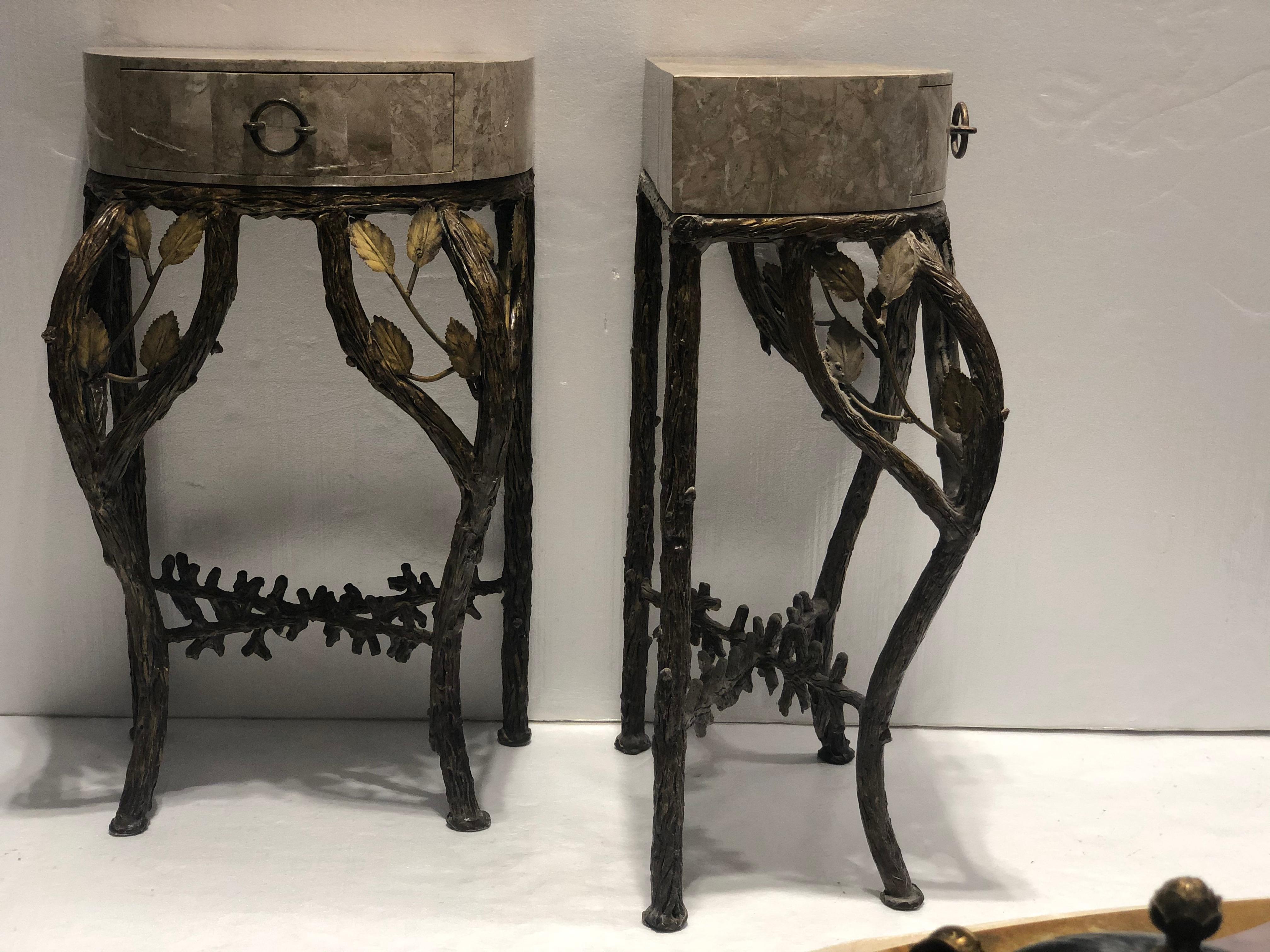 A pair of Maitland Smith console tables comprised of tessellated marble top, with a pull out drawer. Supported by naturalistic branch motif legs and base.
Circa: 20th cent. Perfect for displaying artwork in entry way and or a decorative hallway.