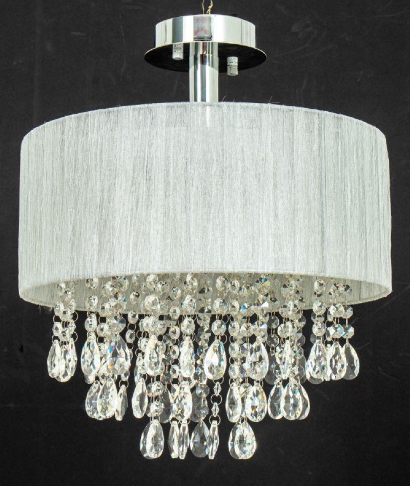 Possini silver and crystal chandelier or semi flush pendant, the central mount supporting a silver fabric-covered barrel frame with three tiers of pendant crystals. Measures: 18