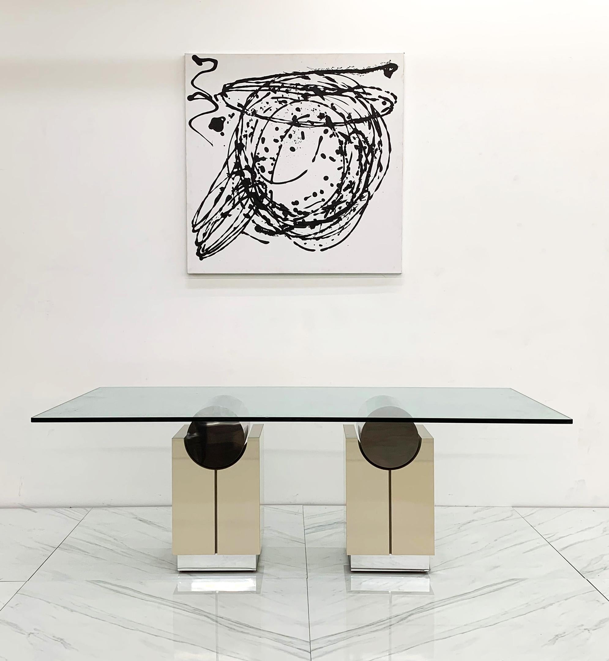 Available we have this absolutely gorgeous double pedestal dining table or writing table. These table bases feature a mirrored finish stainless cylinder shaped tops with a peach, or flesh-toned lacquered bases. This dining table makes a subtle post