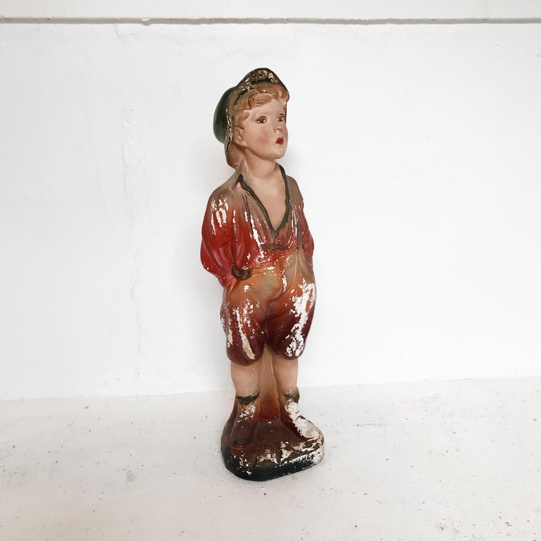 Whistling boy hot sale figurine