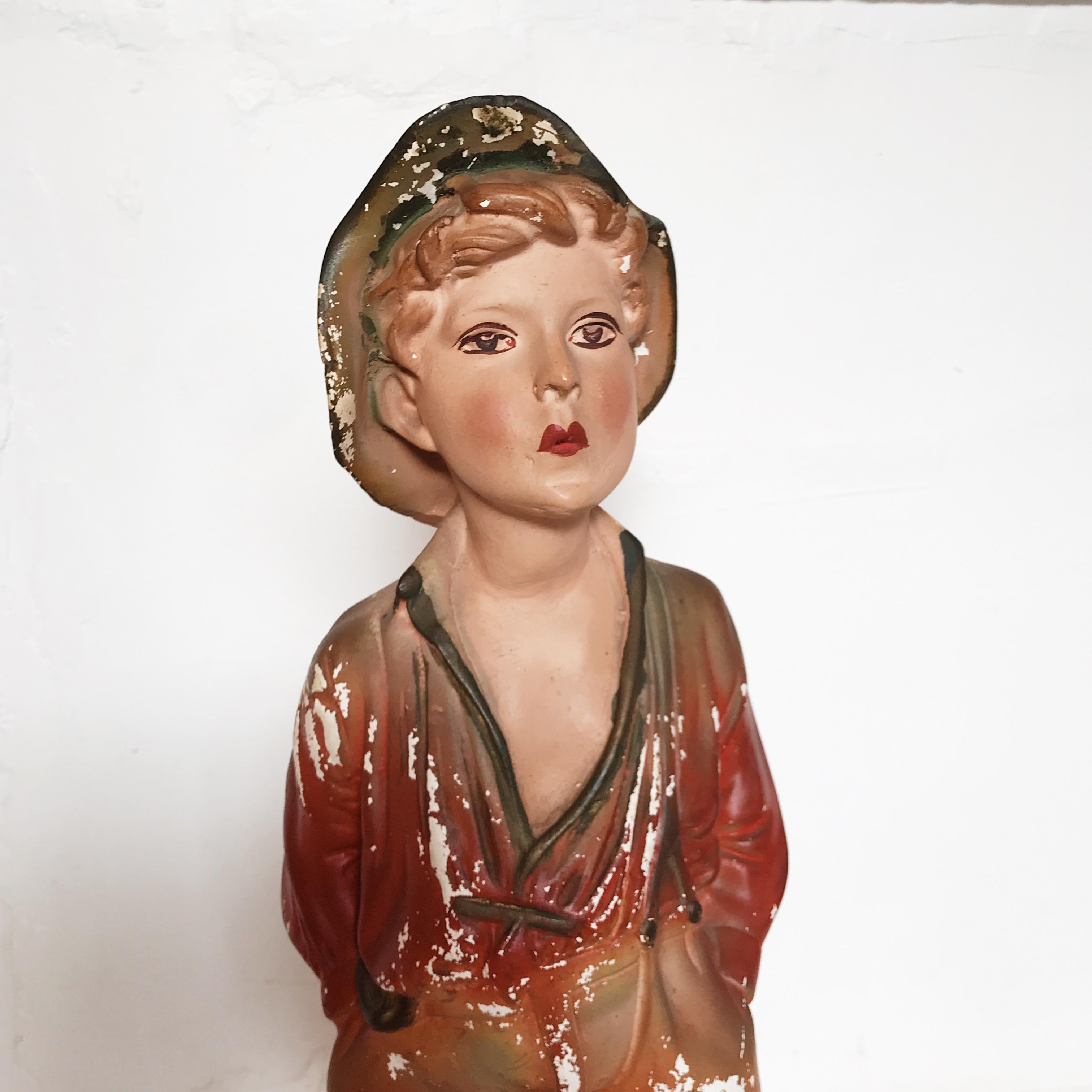 whistling boy chalk statue