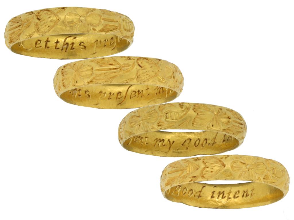 Post Medieval engraved posy ring 'Let this present my good intent'. A rare ring, the exterior of the D-shape band intricately engraved with hearts pierced with arrows and flower motifs, the interior inscribed in italic script 'Let this present my