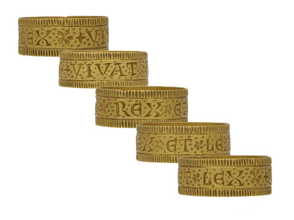 Post Medieval Sergeant-at-Law ring 'Long Live the King and the Law'. A wide yellow gold ring, engraved to the exterior '+VIVAT*REX*ET*LEX' translated from Latin as 'Long live the King and the Law', decorated with carved linear borders, floral motifs