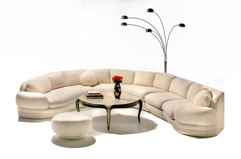 Large Post Modern Sectional Sofa by Preview professionally reupholstered in highly durable super soft ivory white bouclé. If there was a ever a decade when furniture became CURVY, it was the 1990s. From famous iconic mid century modern designers