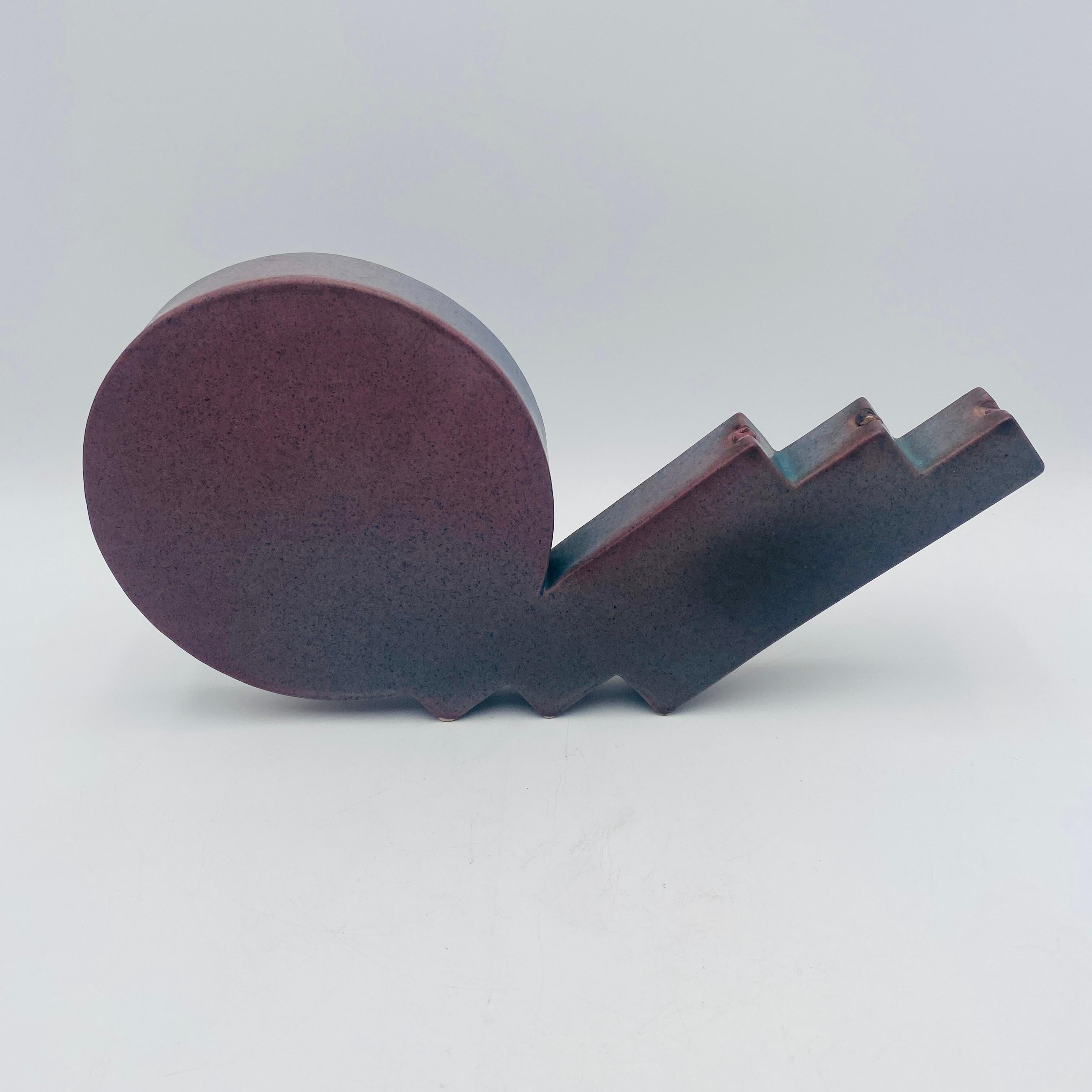 A stunning example of post-modern ceramic sculpture. The piece has a beautiful splattered glaze with blue, pink, and purple hues. There are two wick oil diffusers with ceramic tops (one appears to be missing). The sculpture is unsigned. 