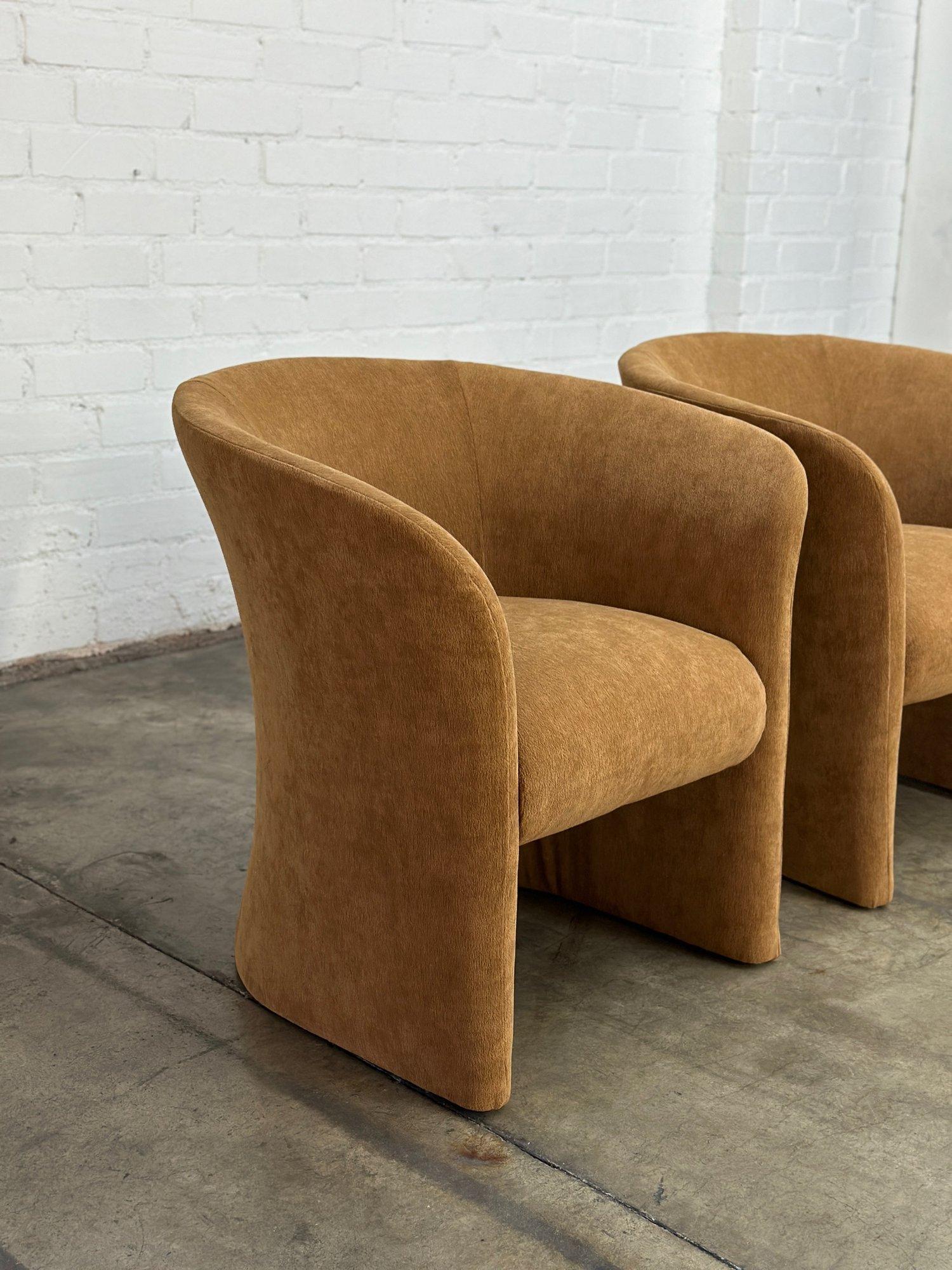 W30 D19 H29 SW17 SD19 SH17 AH26

Pair of newly upholstered curved barrel back chairs. These feature slightly sculpted design with a sturdy inner metal frame. Chairs show well with no visible areas of wear. Price is for the pair.