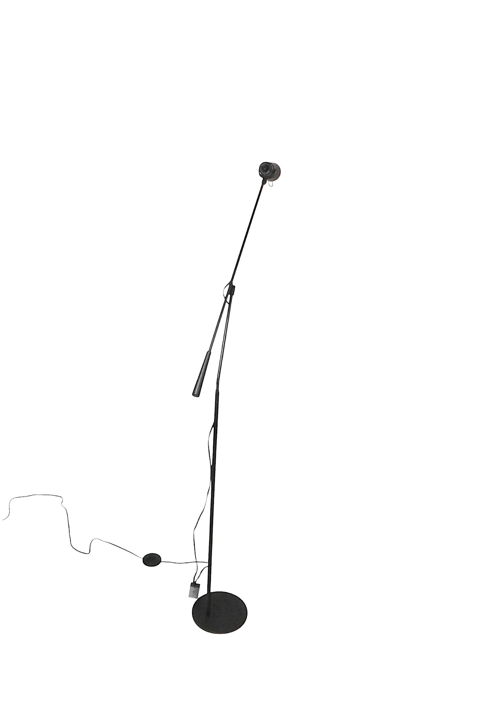 Interesting Post Modern age poise floor lamp, having an adjustable arm and pivoting head. The lamp is in very good, clean, working condition, it accepts a standard size halogen bulb. Originally this lamp had a European plug and wattage reducer. We