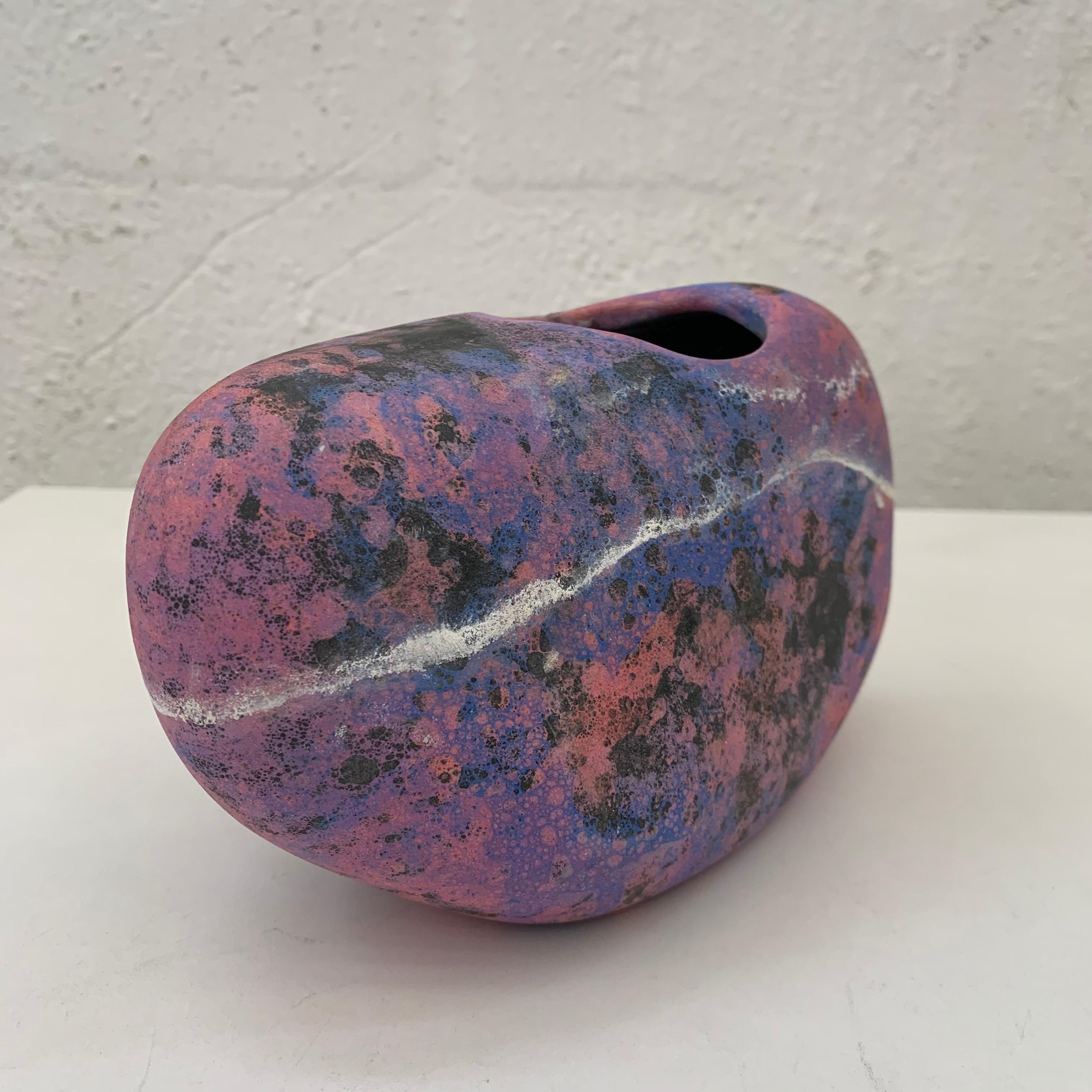 Sculptural amorphic vase rendered in thin walled pottery with glazes of black purple magenta pink blue and white in an celestial style, handmade, USA.