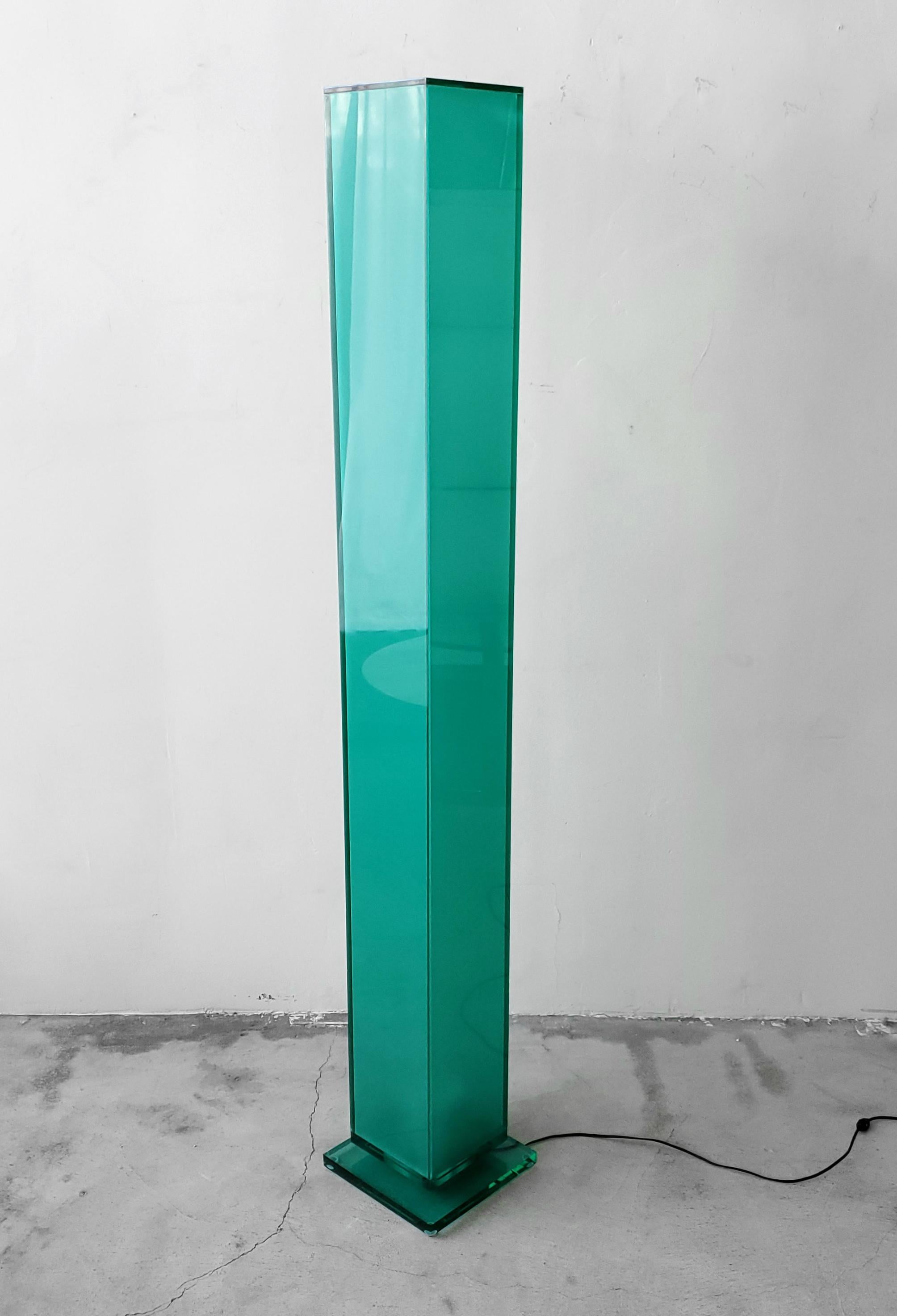 A Postmodern and contemporary floor lamp. Very simple, clean lines. Acrylic is a beautiful translucent sea glass green color. Illuminates from the bottom with a single flood bulb.

Lamp works perfectly and is in excellent condition.

Measures: