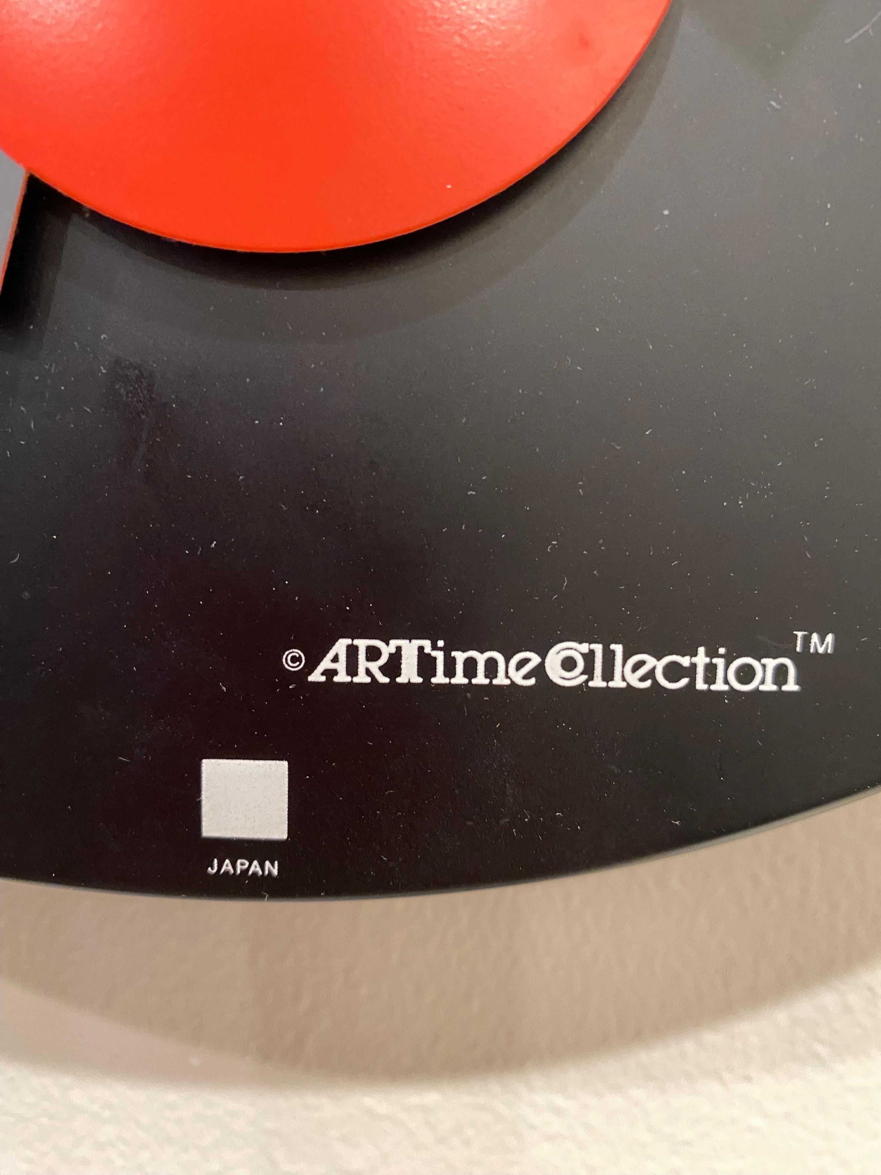 Nicolai Canetti for Art time post modern wall clock. Black enamel background with reds and whites. Sweep second hand. Great design and hard to find! Working condition! Produced in Japan. 1984.