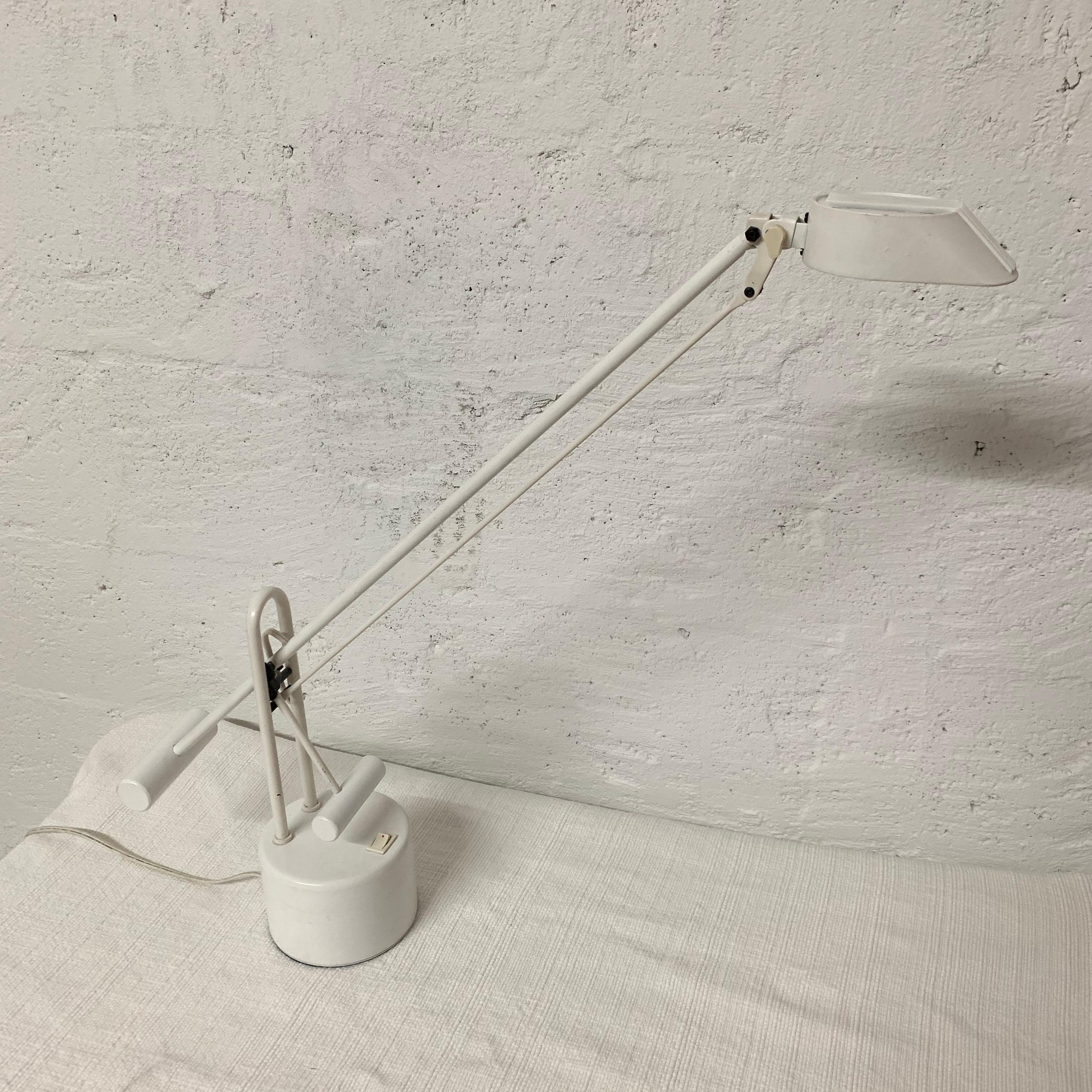 Desk or task lamp with an articulating arm and weight system rendered in white steel, 1980s.