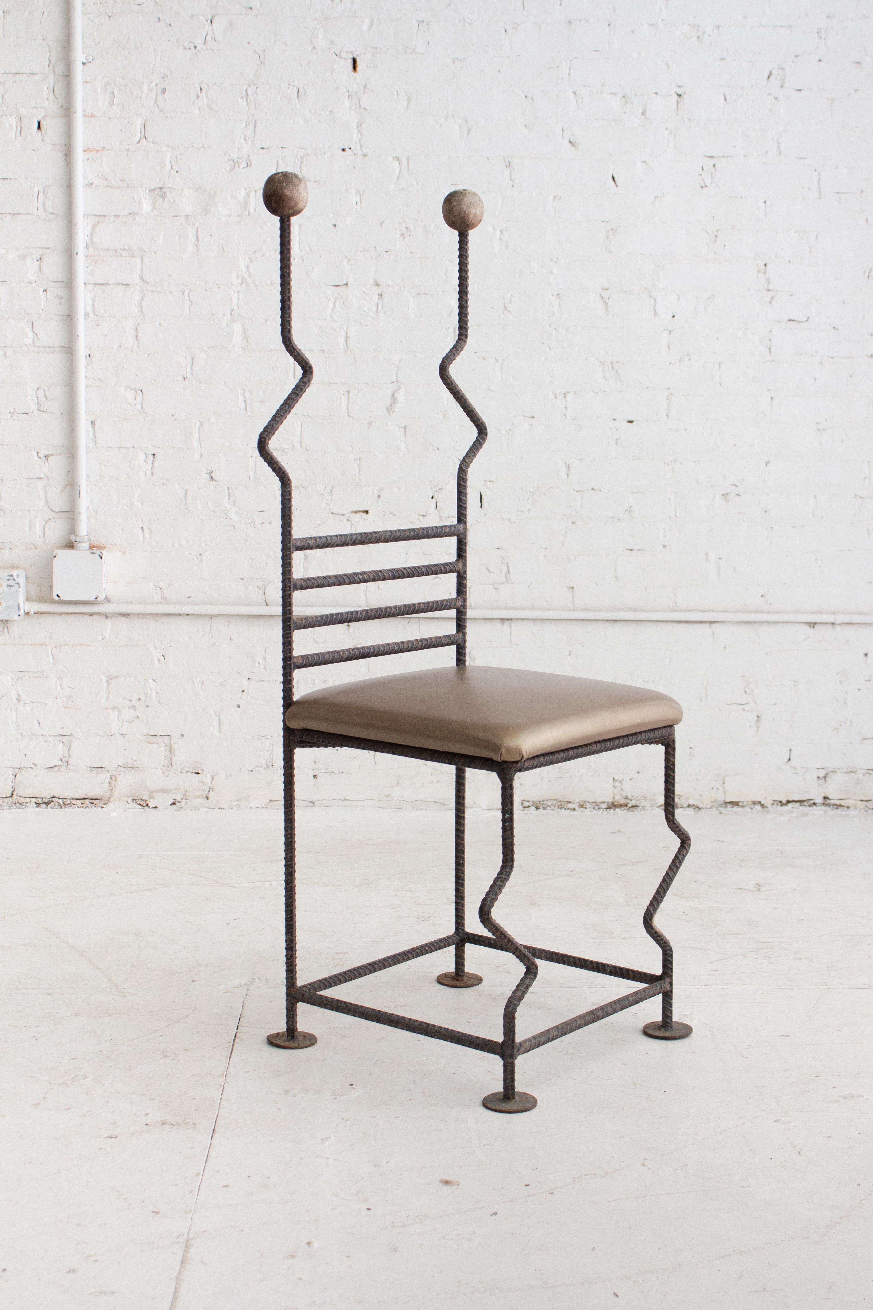 Post modern artisan made throne style chair. Geometric welded rebar frame with weathered wood accents. Newly upholstered metallic bronze leather seat. Provenance unknown. 