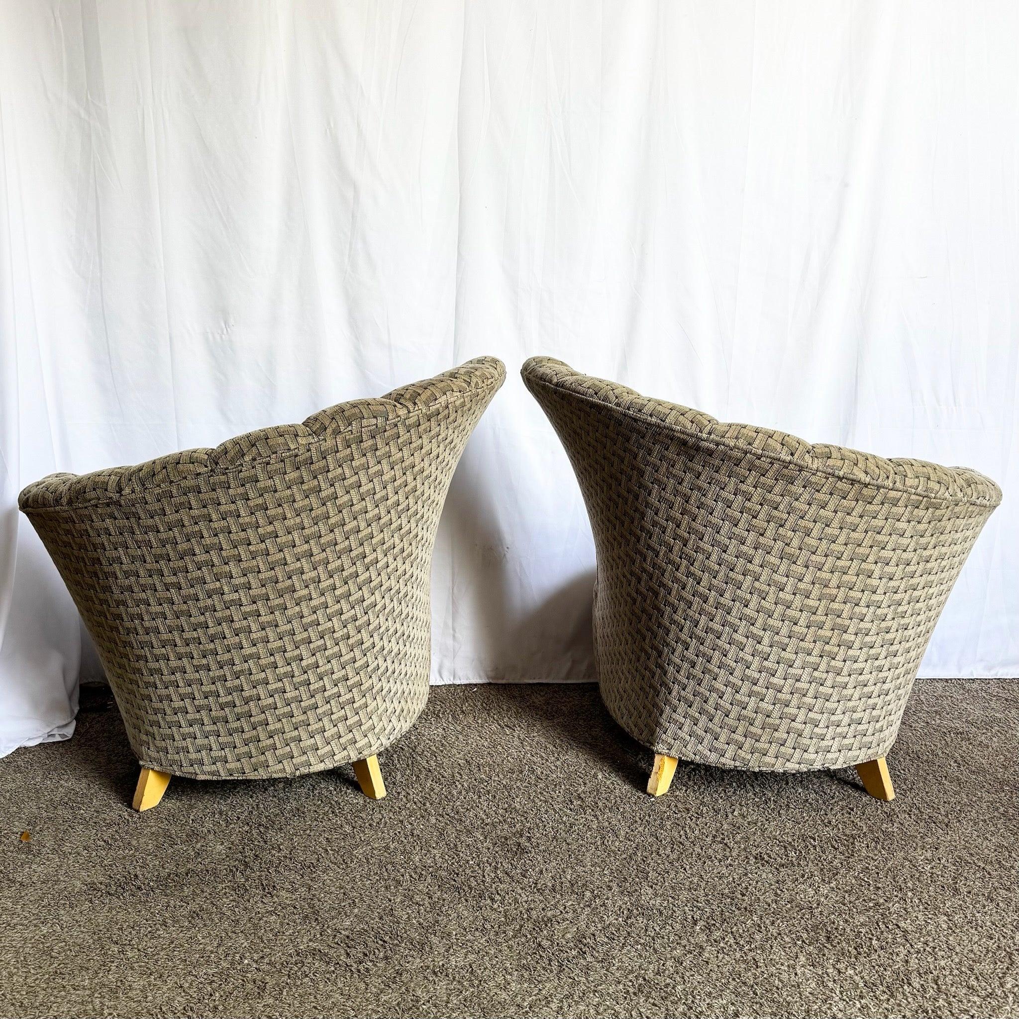 Enhance your living space with Postmodern Clam Shell Lounge Chairs—a sculptural swivel pair blending Art Deco and 1980s elegance.
 

 Minor wear to the fabric and feet as shown in the photos.
 

 We sell items as acquired, without restoring or