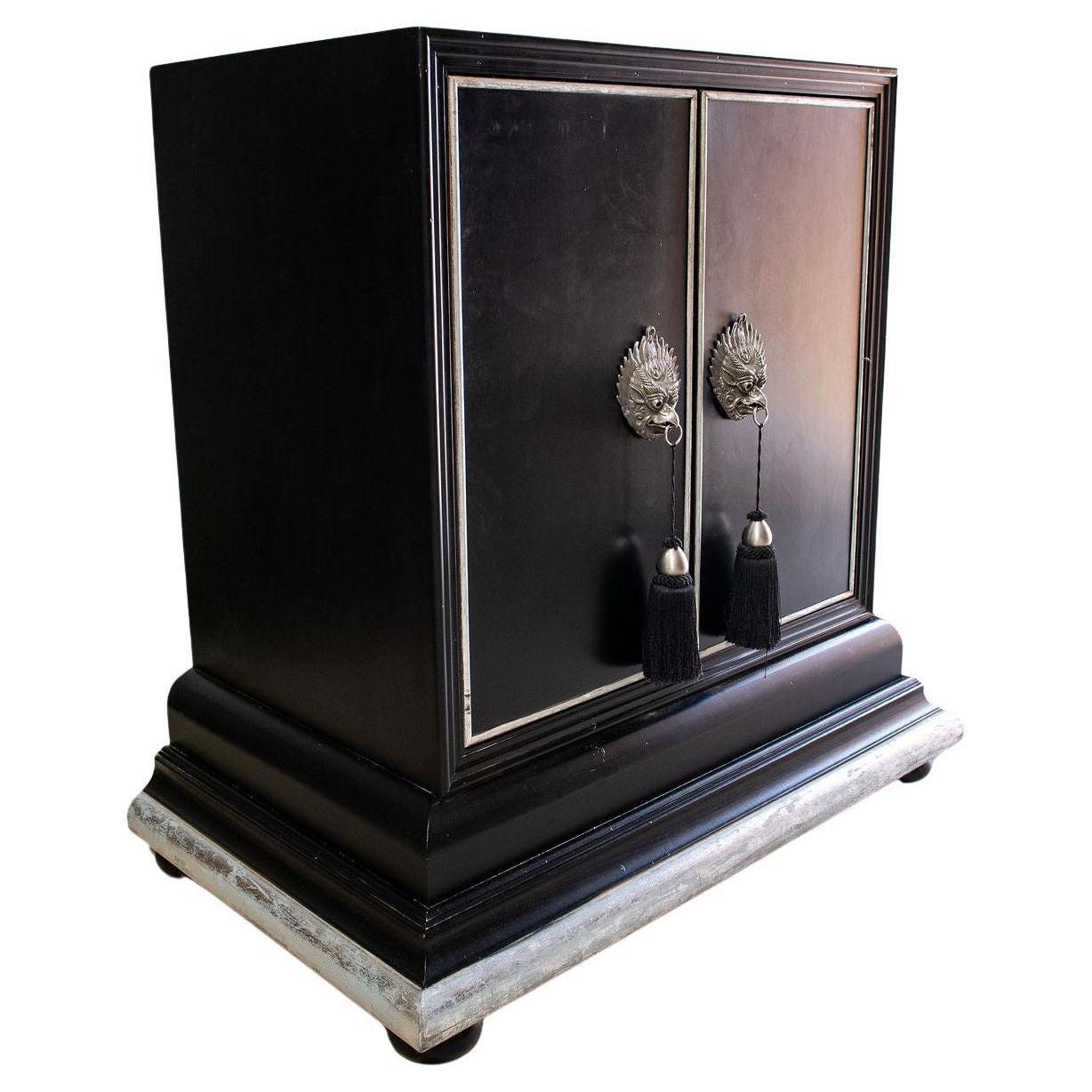 This stunning black and silvered cabinet can be used for many purposes.  it was originally a tv cabinet and has been fully restored into dry bar.  The pull out tray is mirrored and holds bottles and other decorative items.  The hardware is original