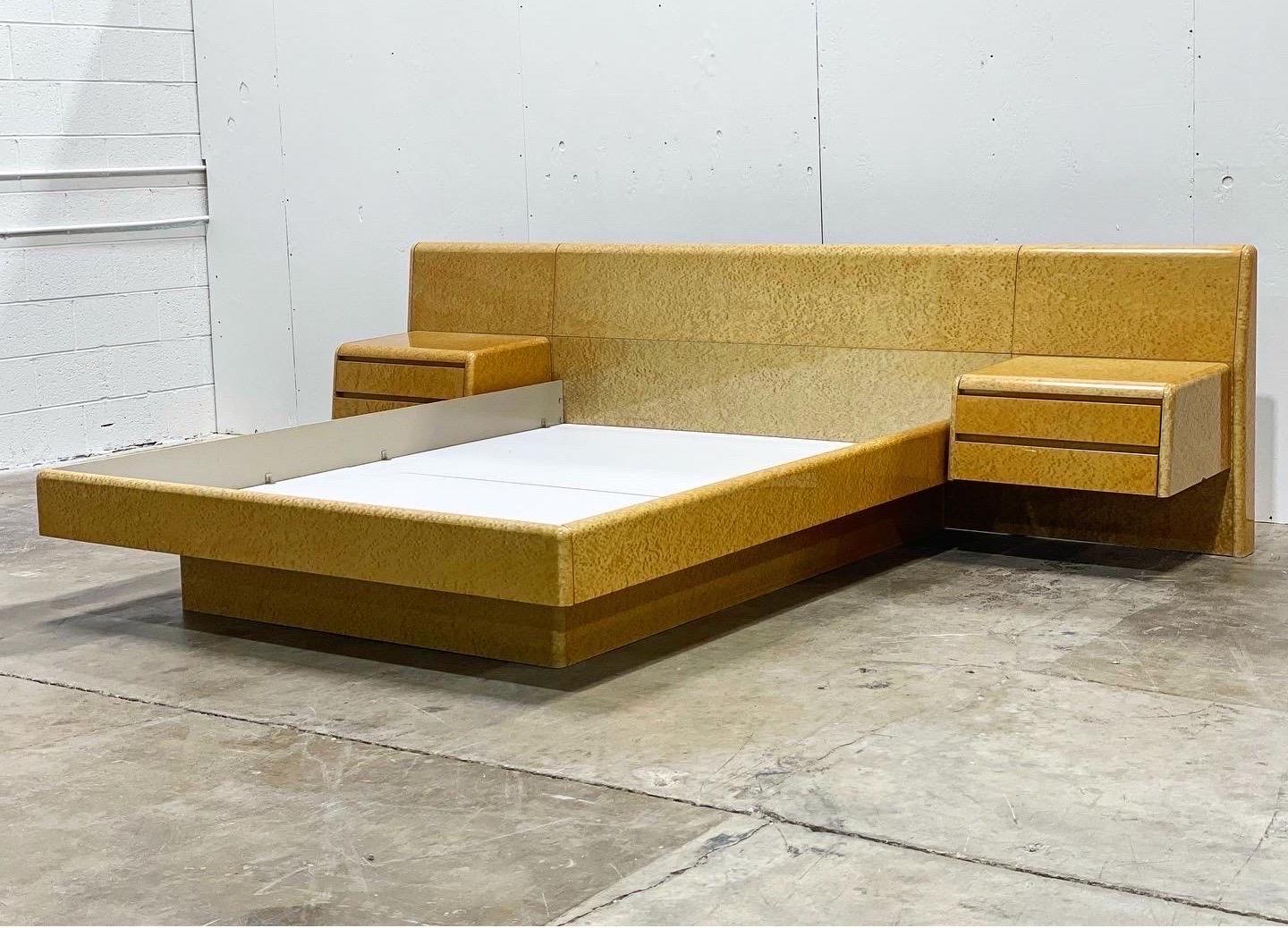 Unique on the market - exquisite post modern queen bedroom set by COMA, Italy circa 1978. Set consists of a queen platform bed with floating nightstands, a six drawer dresser and and gentleman's chest/armoire. Stunning lacquered birdseye maple.