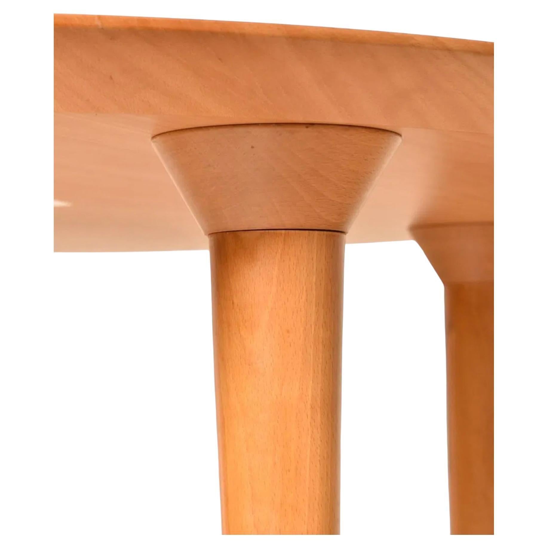 Italian Post modern beech round dining Table with tapered legs by Lluis Clotet For Sale