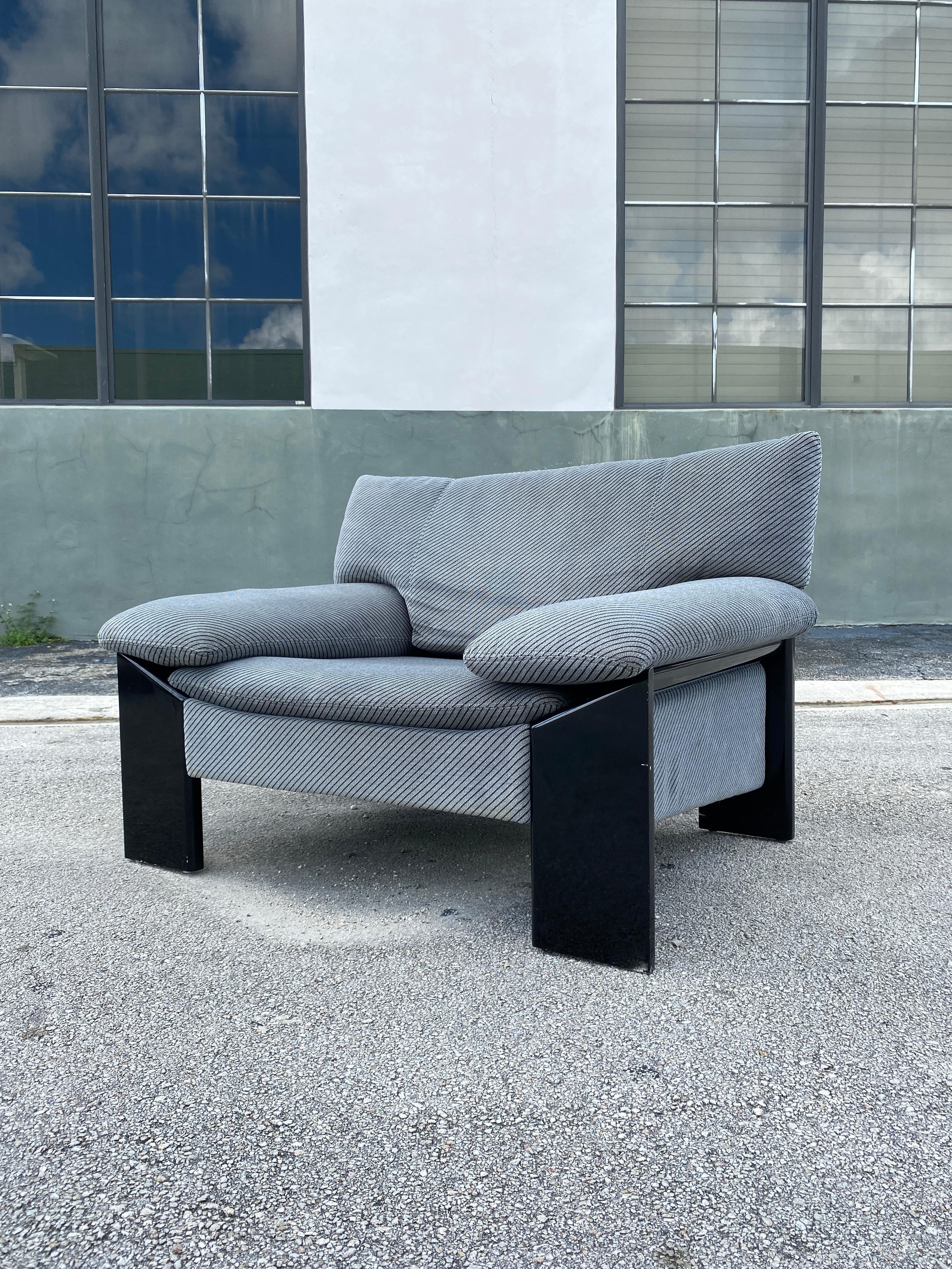 Vintage unique black lacquered high gloss wooden frame armchair in the style of Sapporo. This lounge chair features original grey velvet upholstery with dark blue pinstripes.Circa 1970s.

62”W x 26”D x 28”H x 14”Seat H x 17”Arm H
Part of