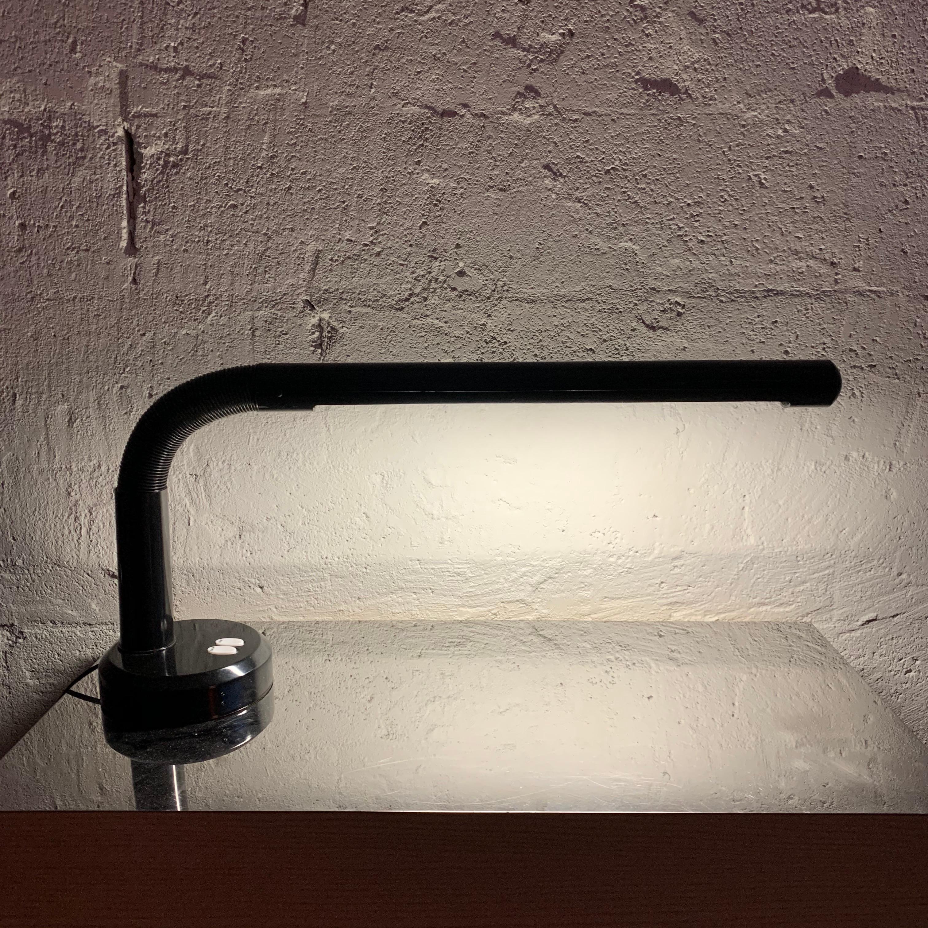 Postmodern adjustable goose neck desk or task lamp rendered in black plastic and metal.