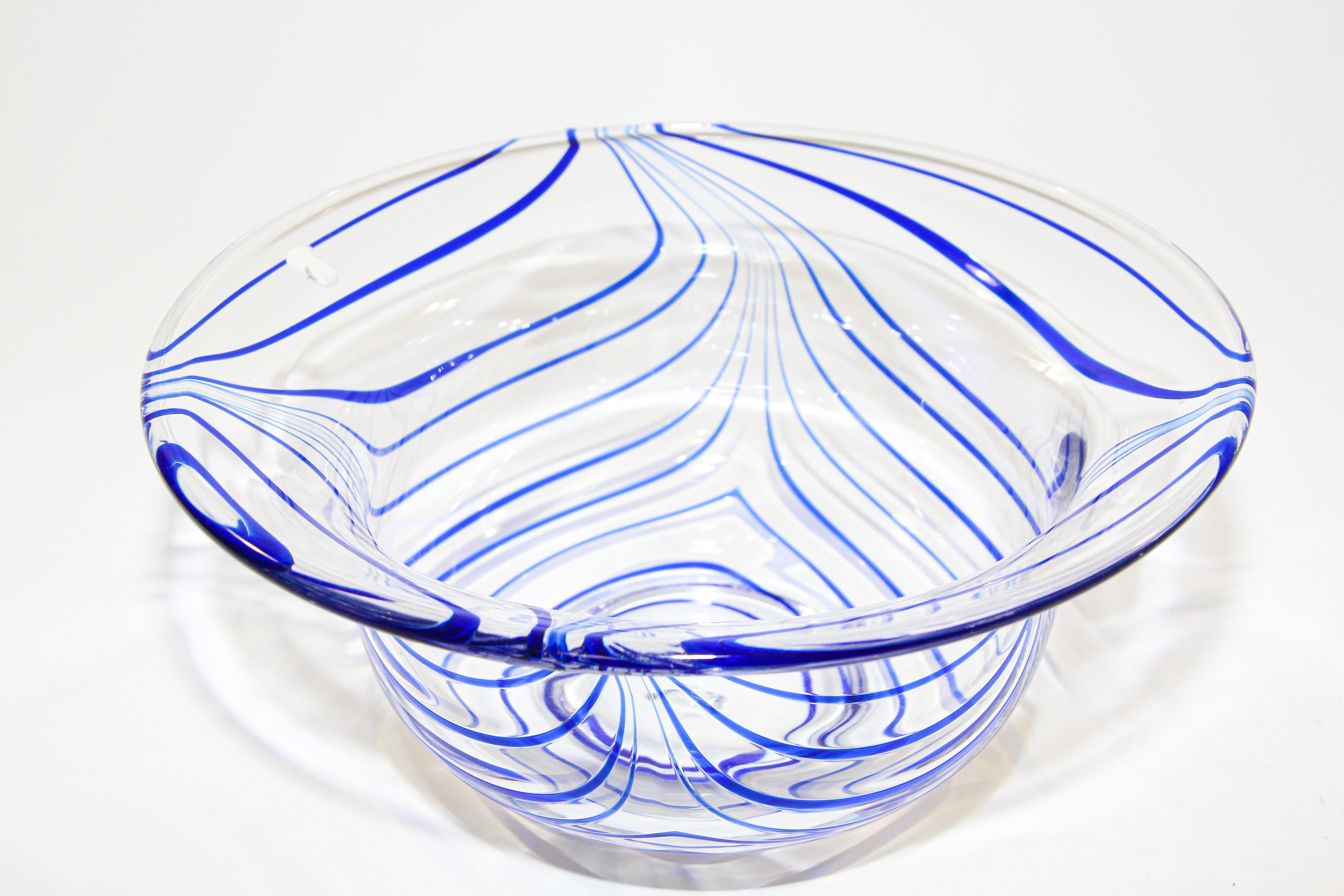 Large vintage exquisite post modern decorative hand blown Murano art crystal glass bowl with a swirl stylized design in an amazing royal cobalt blue on clear glass. Italian Mid-Century Modern hand blown Murano art glass bowl. The piece has blue