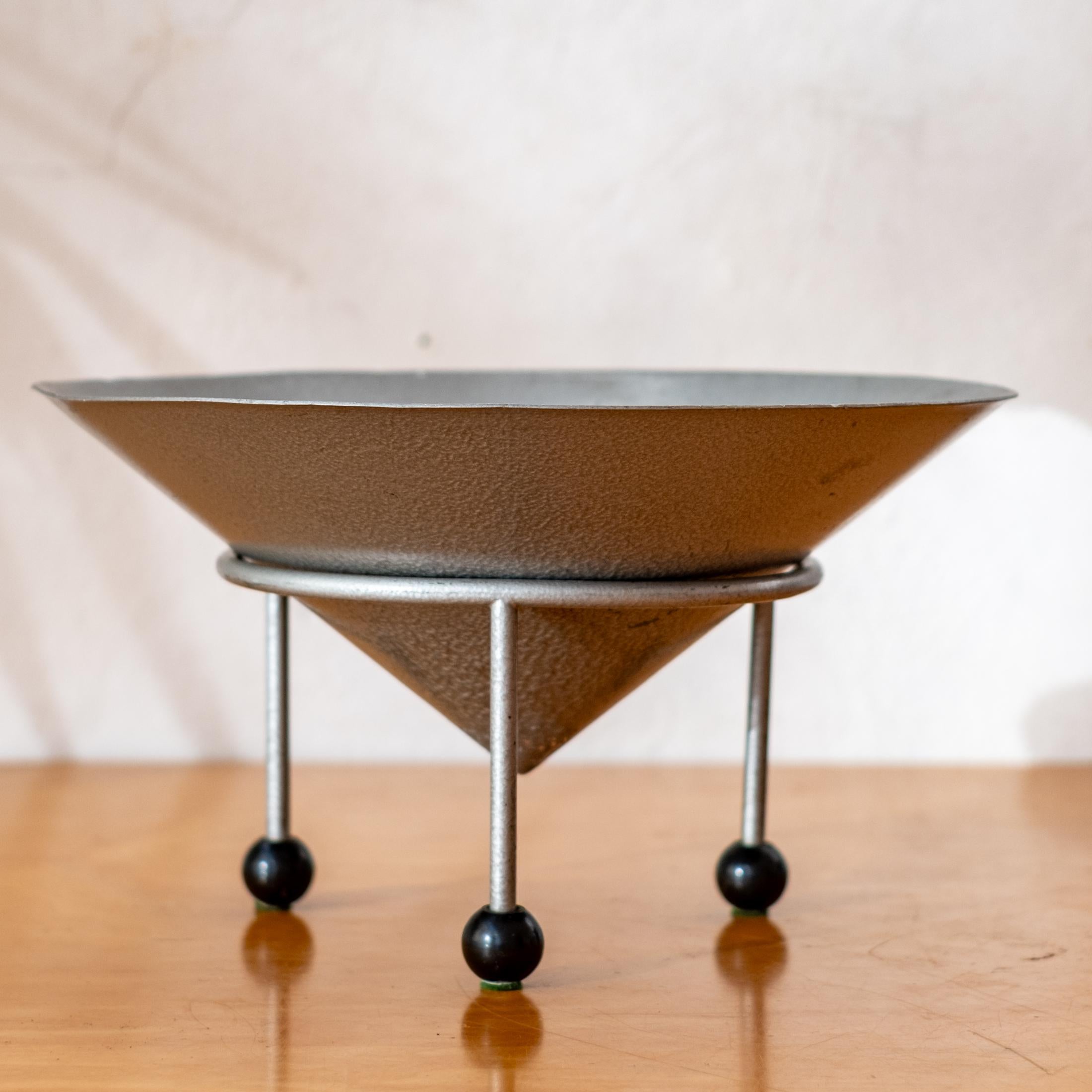 Postmodern fruit bowl by Christian Duc, 1981. France.

The stand is marked Modern Props, which was a Hollywood institution for decades that supplied pieces to some of the biggest film and TV sets from the 70s to its closure in 2020. The owner, John