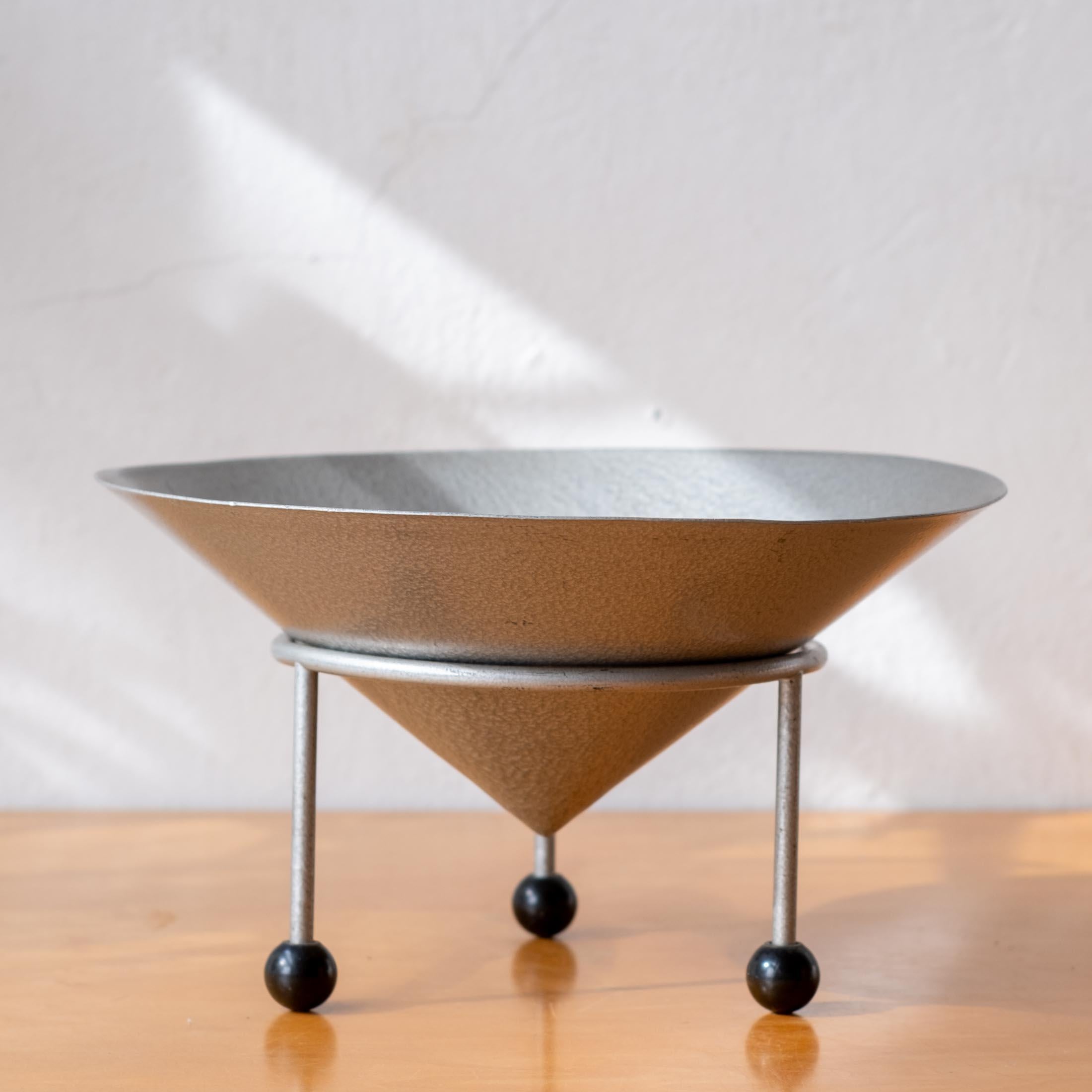 Postmodern fruit bowl by Christian Duc, 1981. France.

The stand is marked Modern Props, which was a Hollywood institution for decades that supplied pieces to some of the biggest film and TV sets from the 70s to its closure in 2020. The owner, John