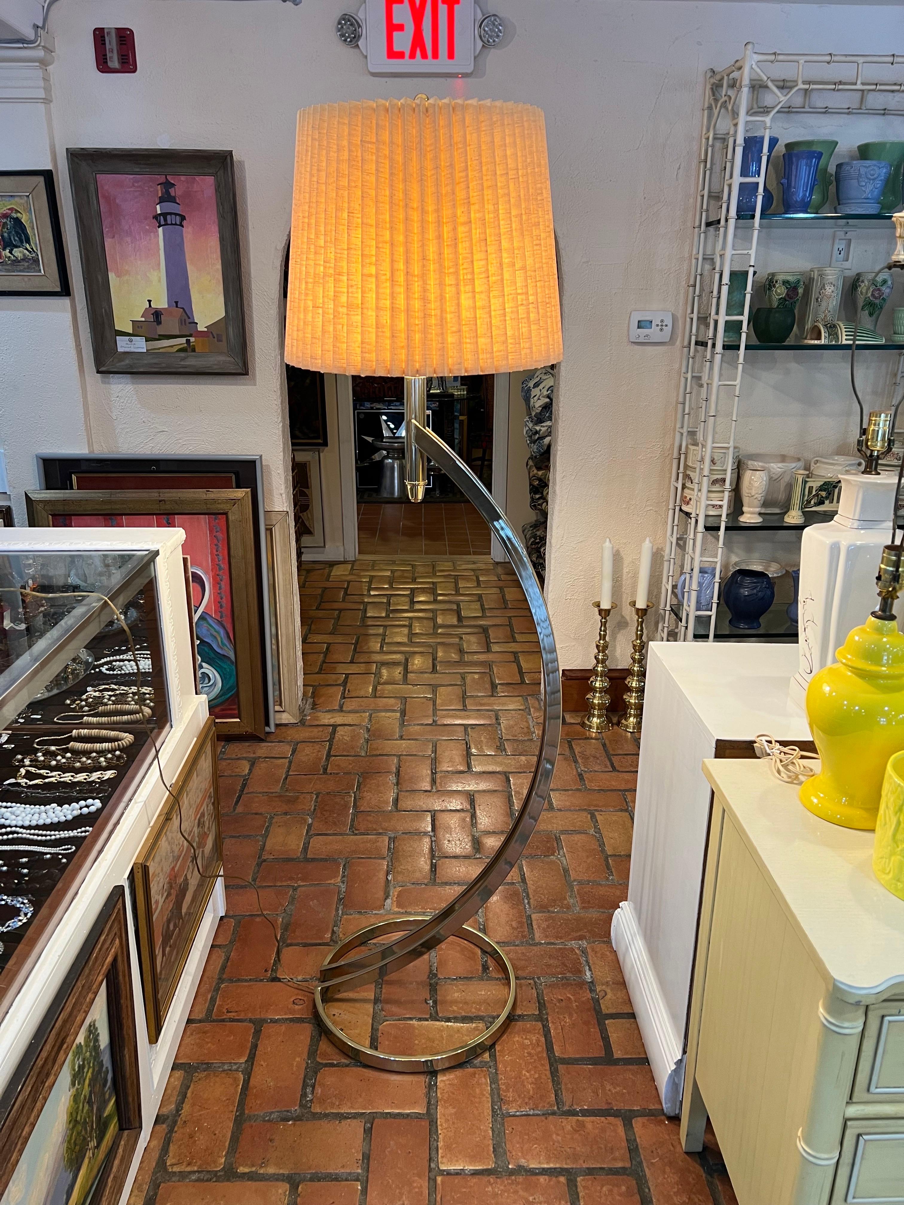 Post Modern Brass Floor Lamp. Authentic midcentury to Post modern style. This floor lamp could also go with Art Deco styles. Great reading lamp. Non adjustable. Includes lamp shade