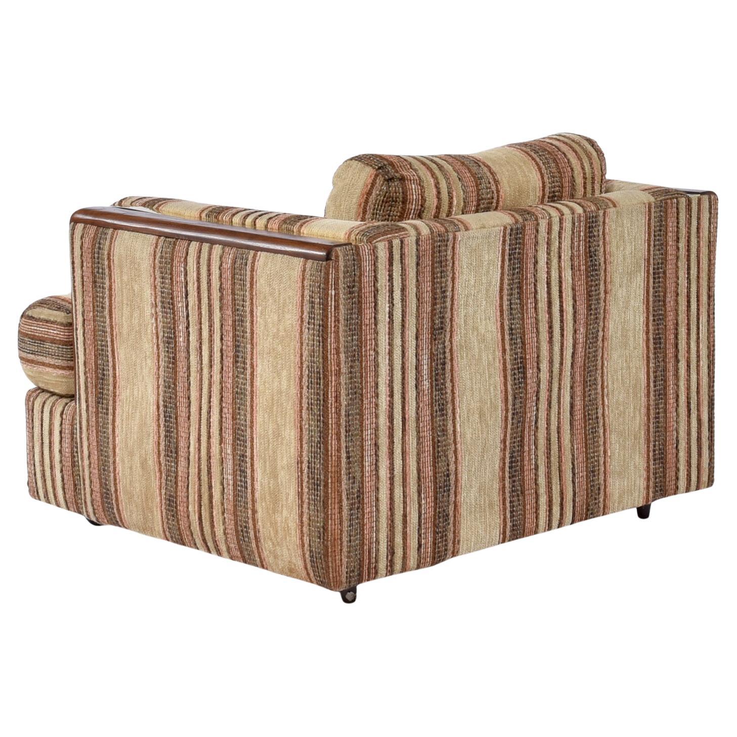 Beautifully preserved Post Modern tuxedo armchair. This vintage 1980s tuxedo armchair is in time capsule condition. A tuxedo chair simply means that the arms are the same height as the back giving it a cube-like shape. These proportions create a