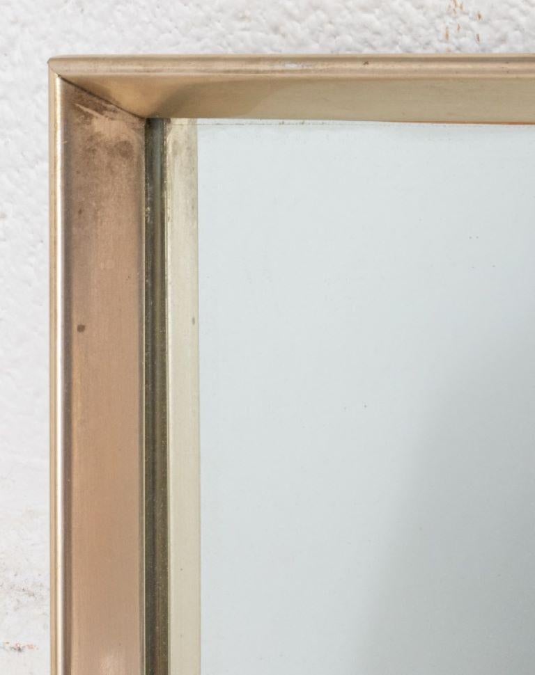 Post Modern brushed gilt metal wall mirror.

Dealer: S138XX